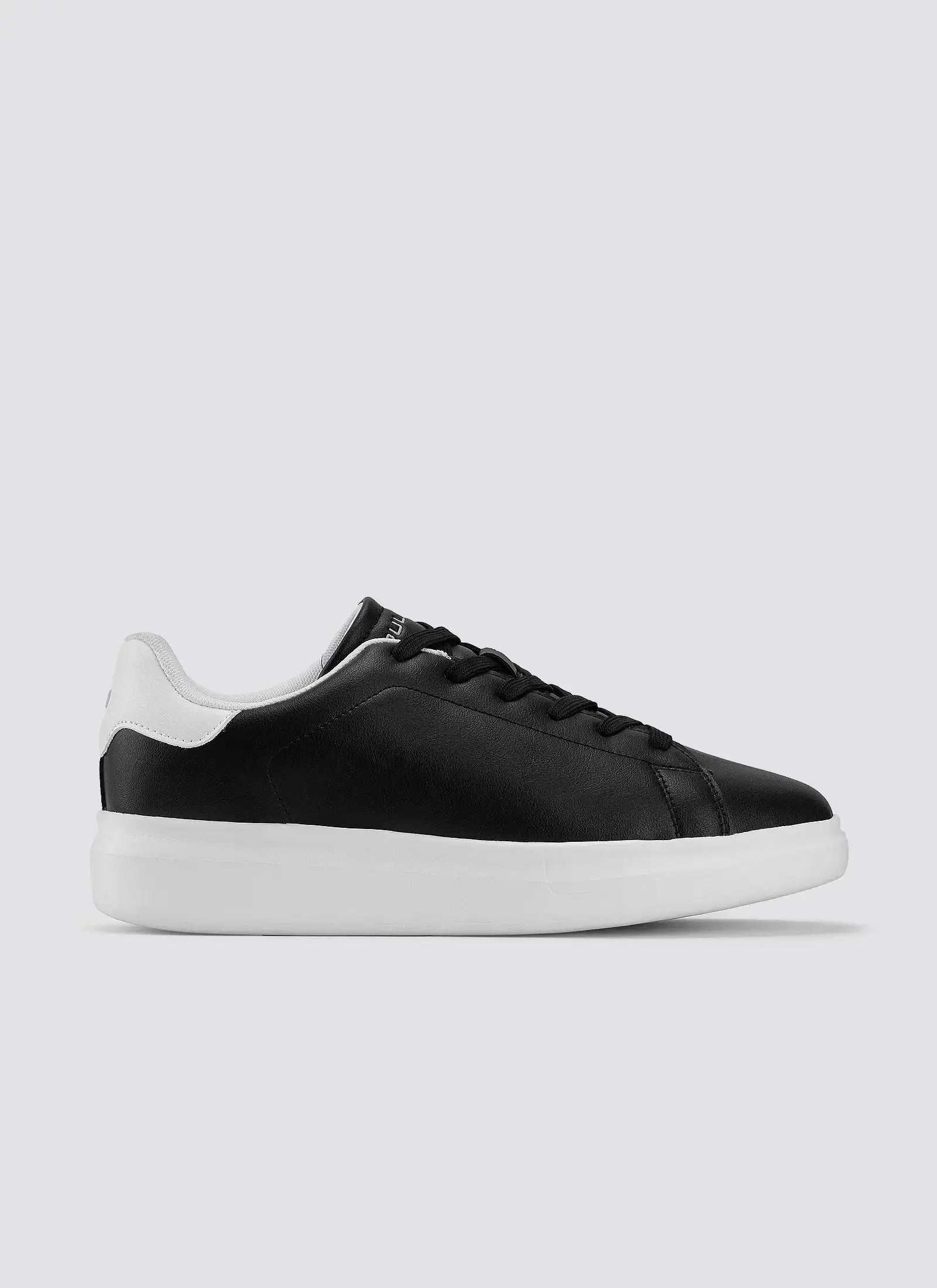 Black and white leather sneaker with white sole, minimalist men's casual footwear