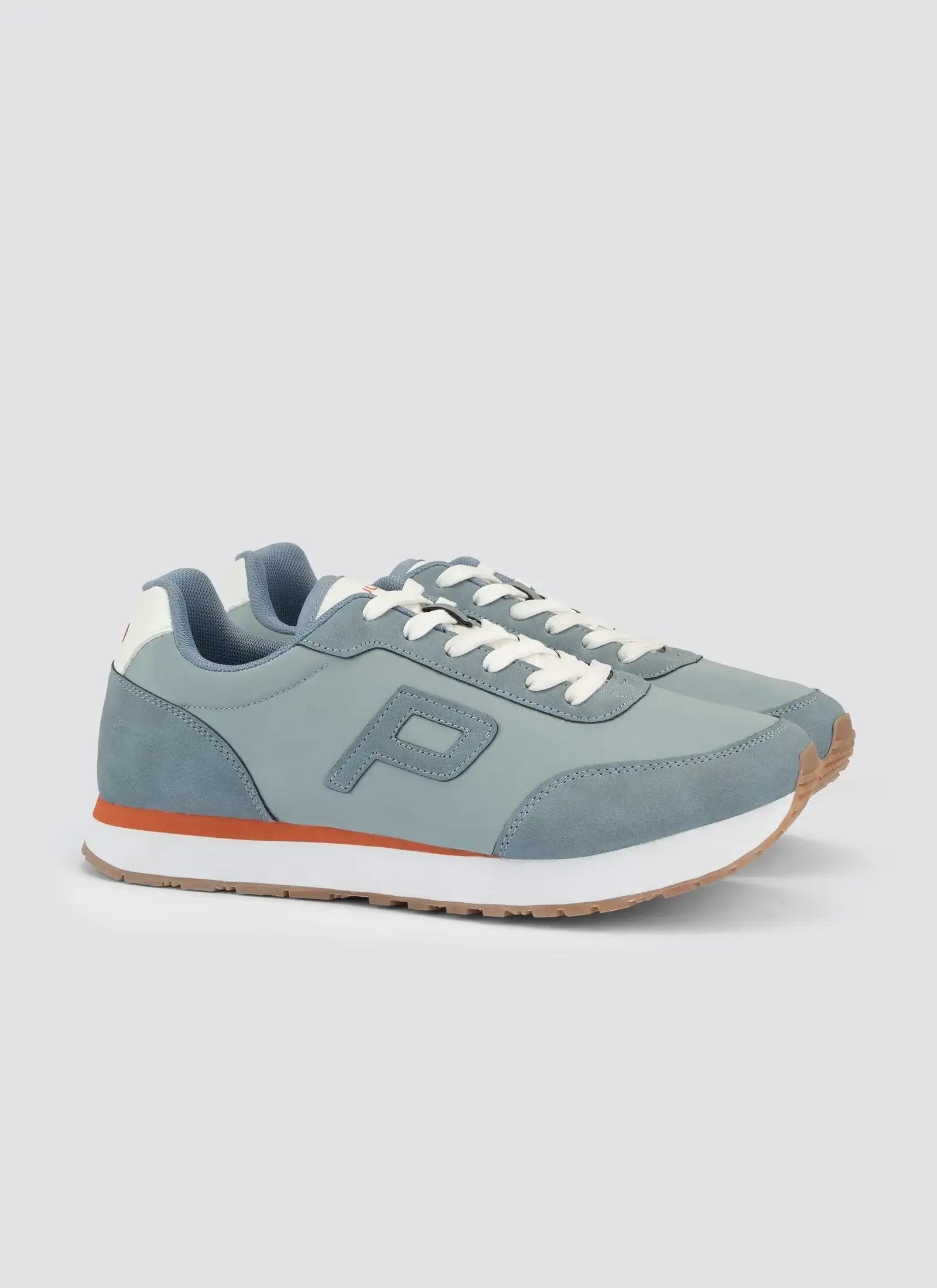 Light blue men's sneakers with white laces and orange stripe on sole, side view