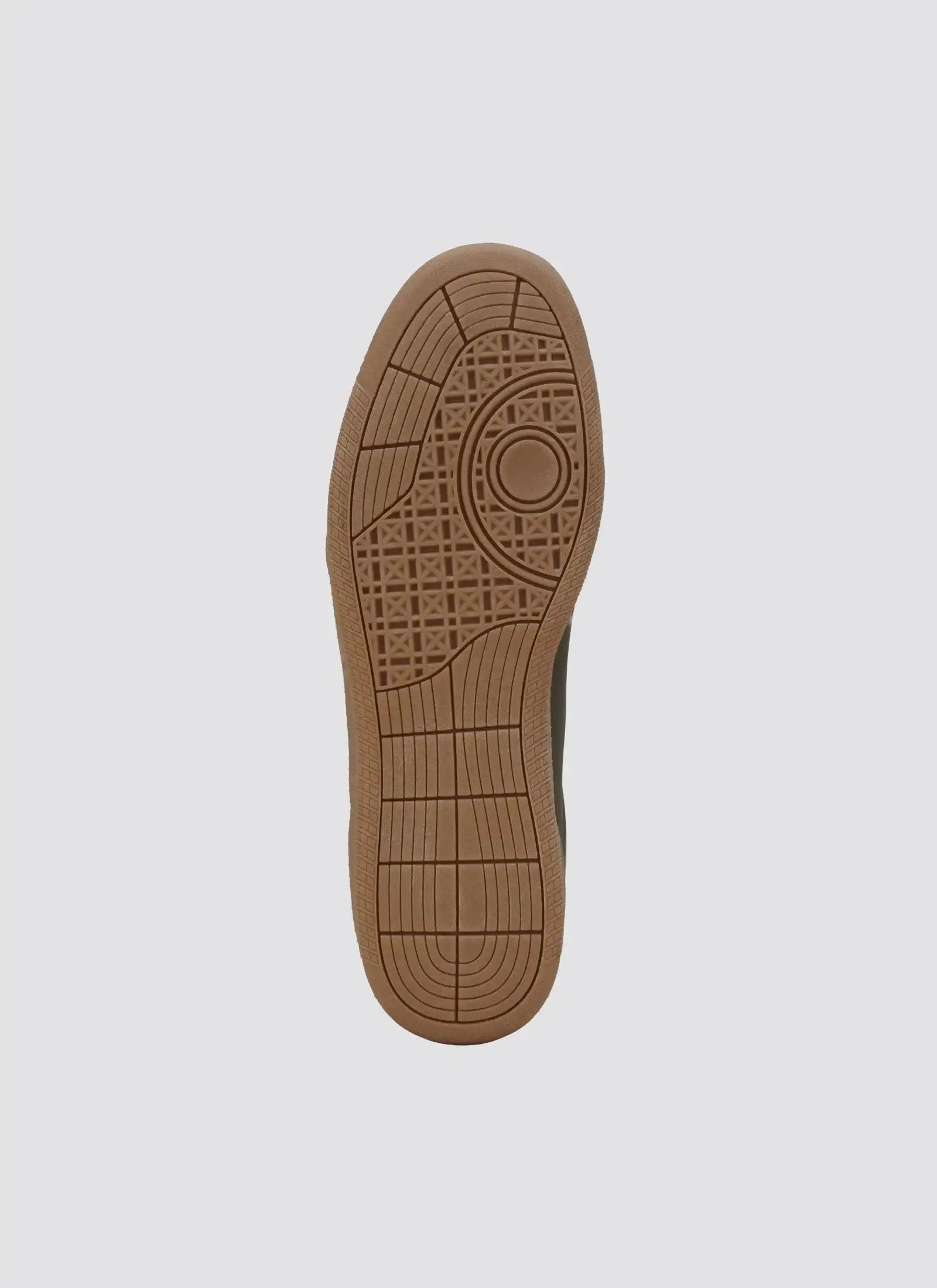 Tan rubber sneaker sole with geometric tread pattern on a plain background