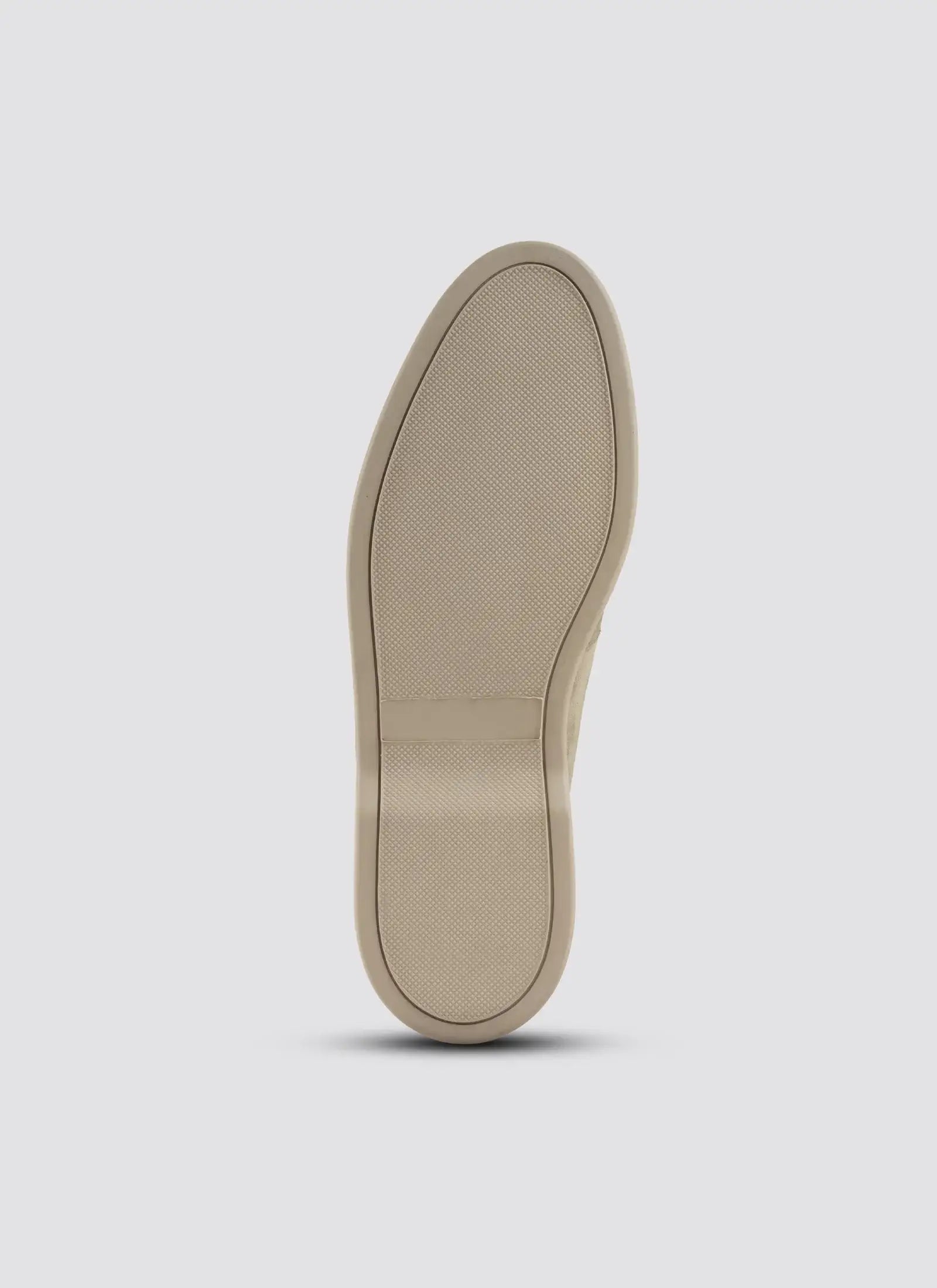 Beige shoe sole on a light gray background