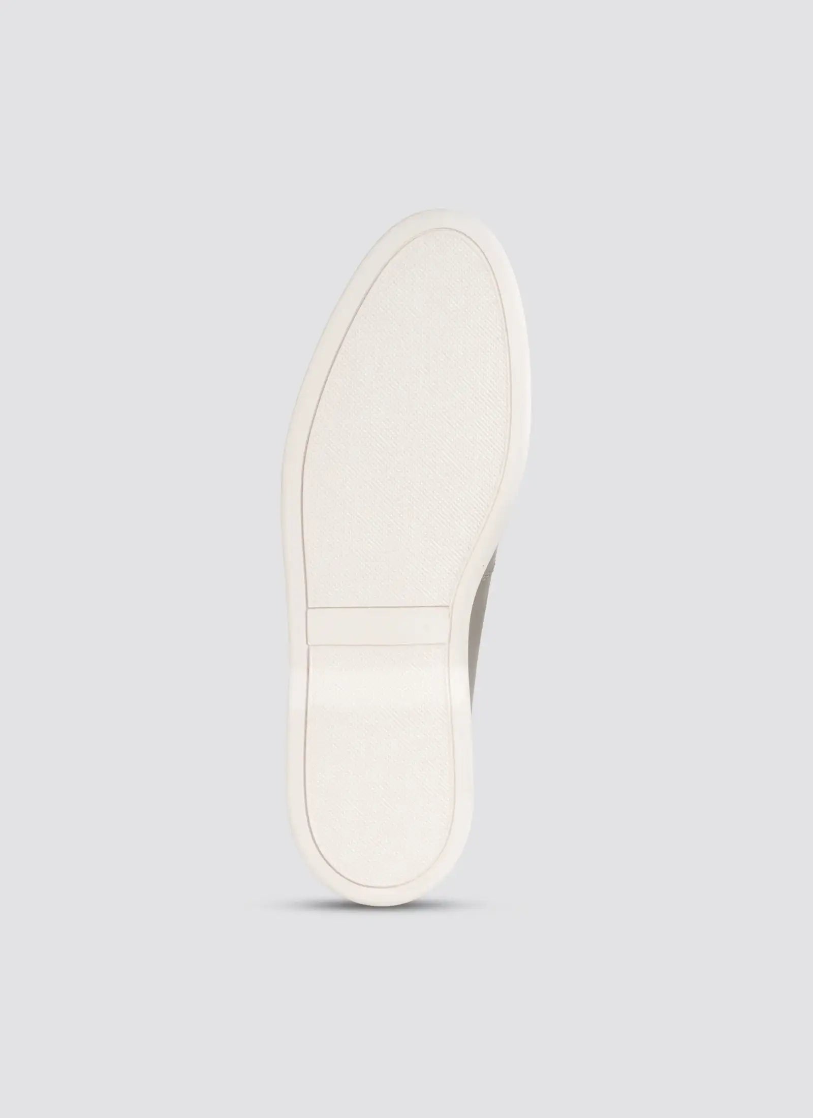 White sneaker sole on a light gray background