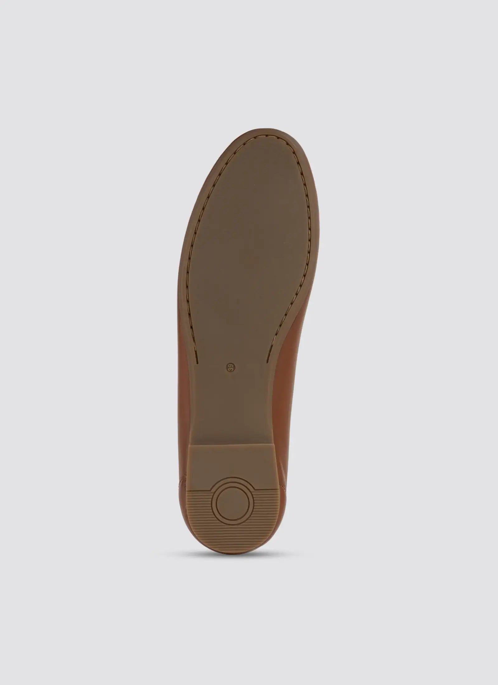 Brown shoe sole on a light gray background