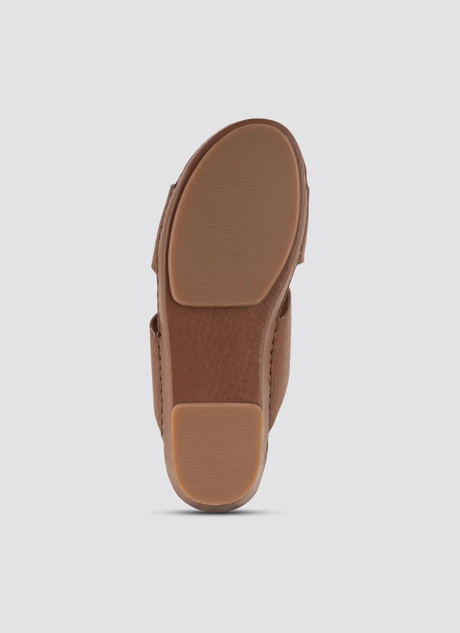 Brown sandal sole on a light gray background