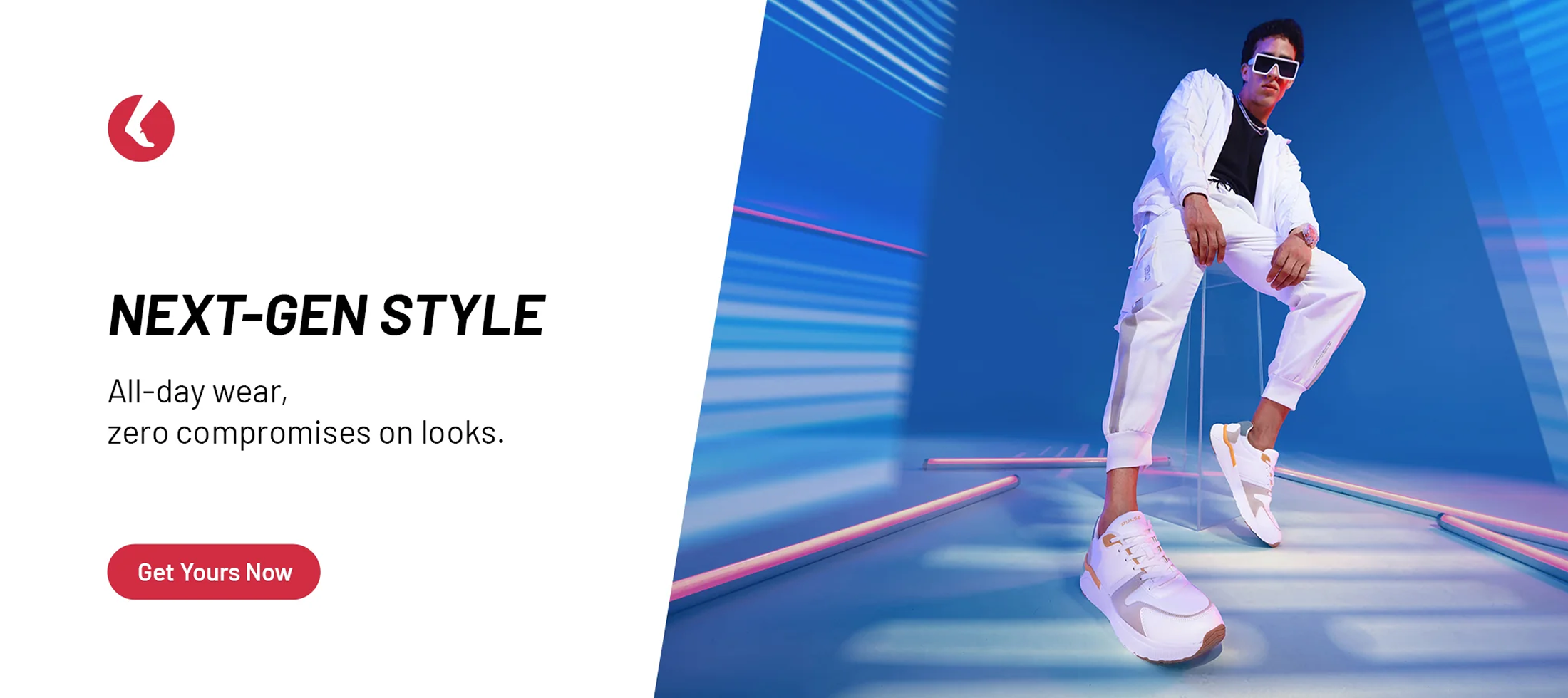 Man in stylish white sneakers and tracksuit, modern blue-lit studio, footwear fashion