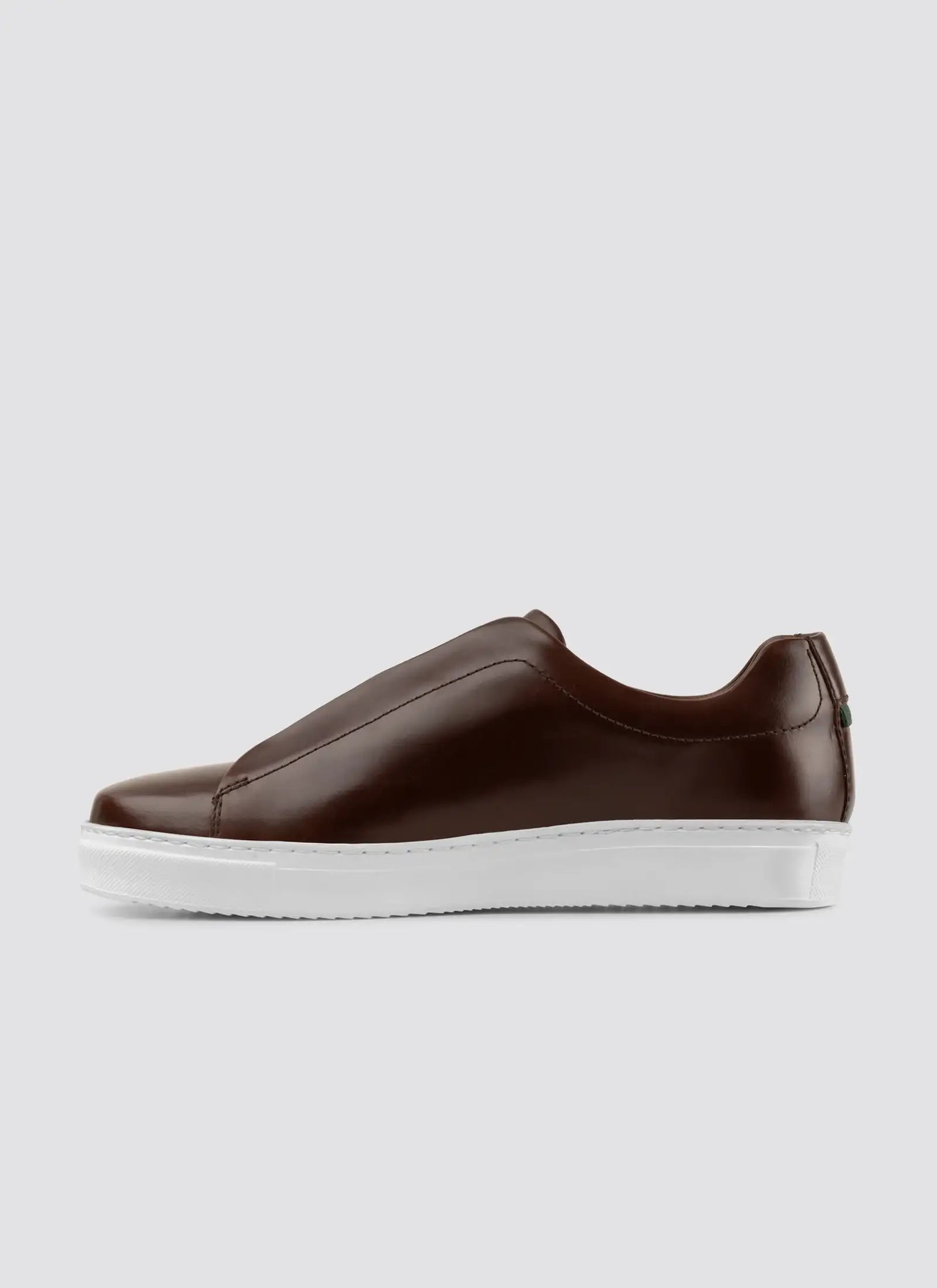 Gray sneaker with white sole on a light gray background