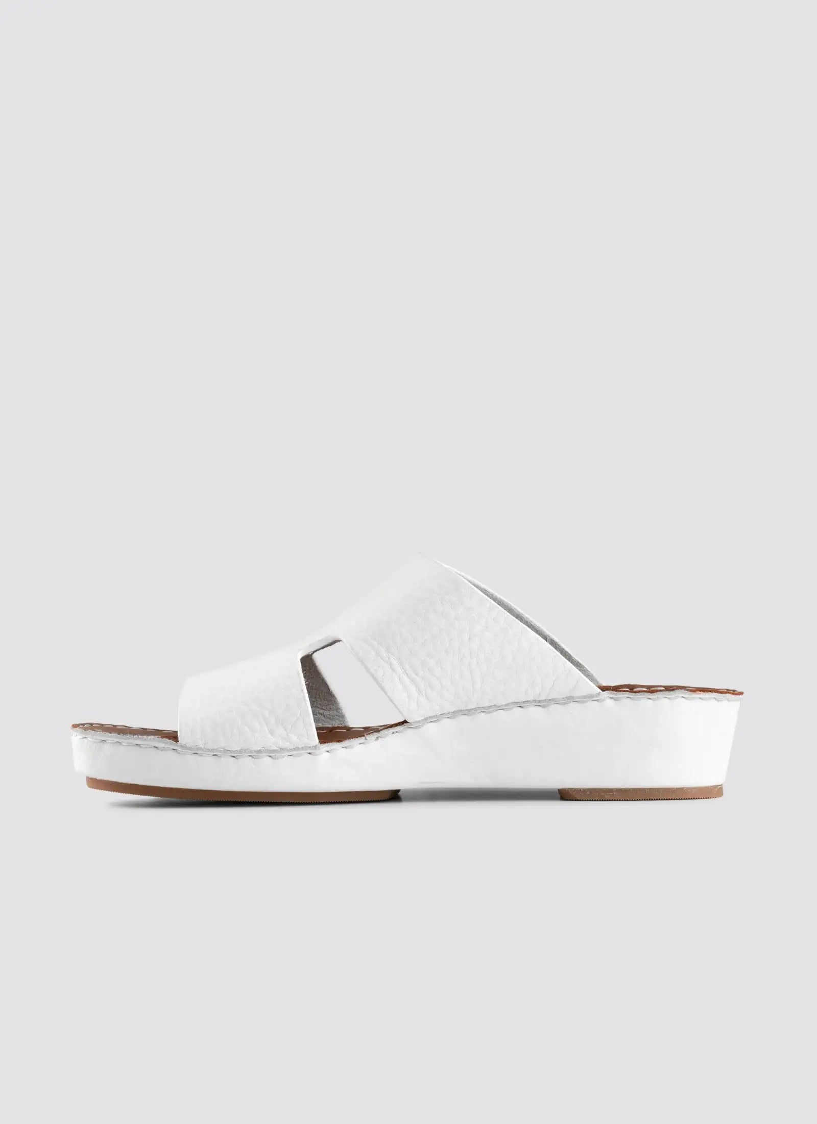 White sandal on a light gray background