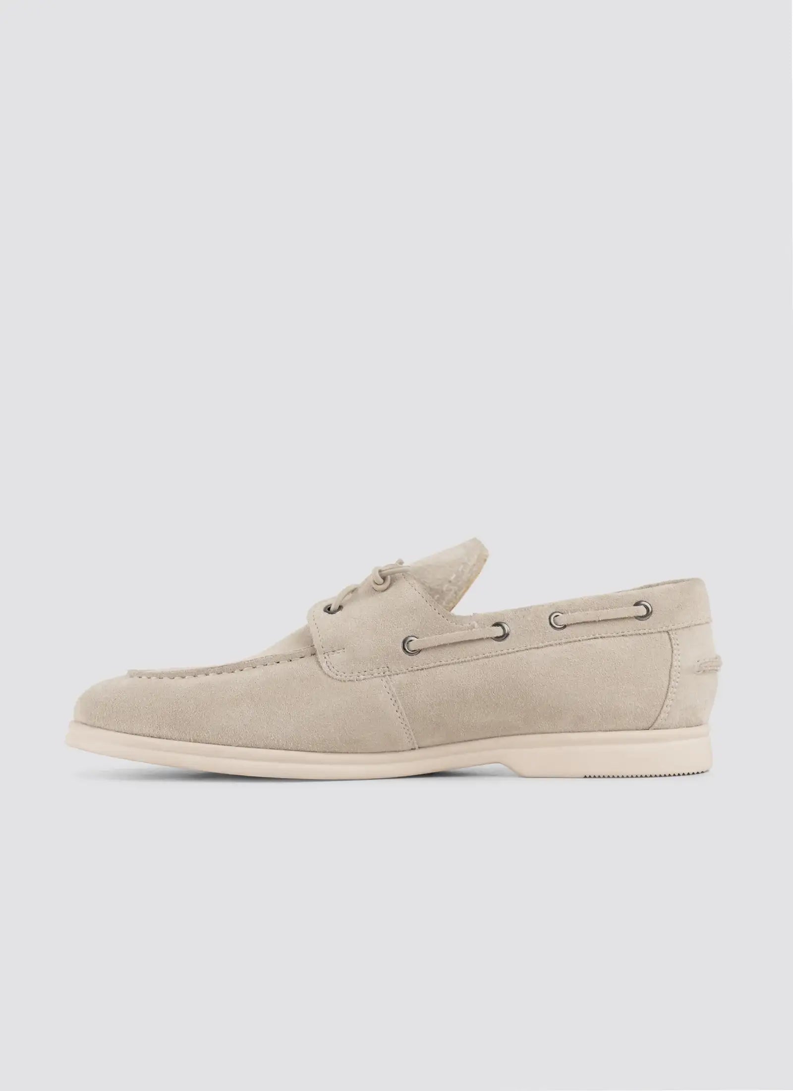 Beige suede men's loafer with lace detailing, side view, on white background