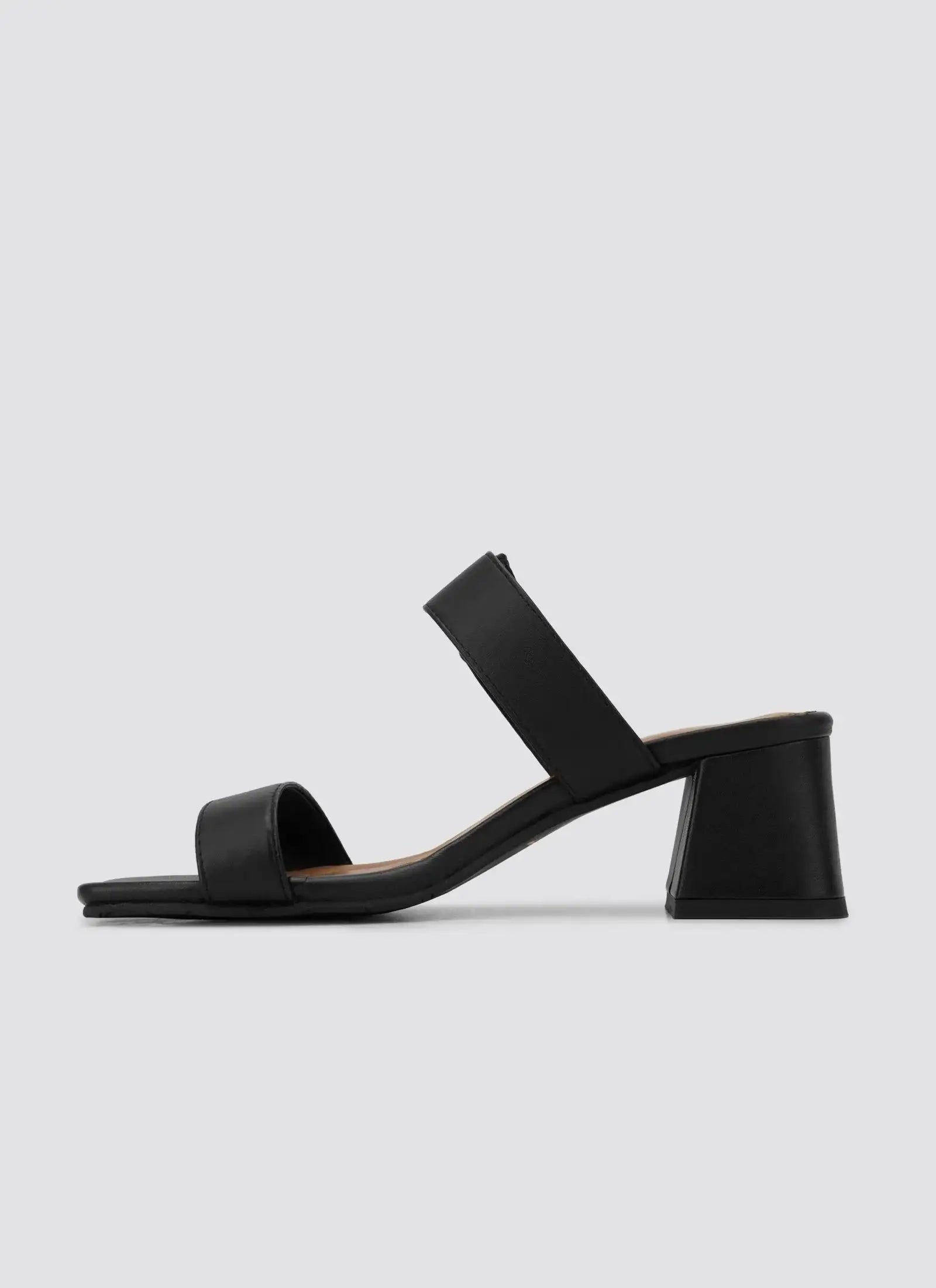 Black block heel sandal with double straps for women, side profile on plain background