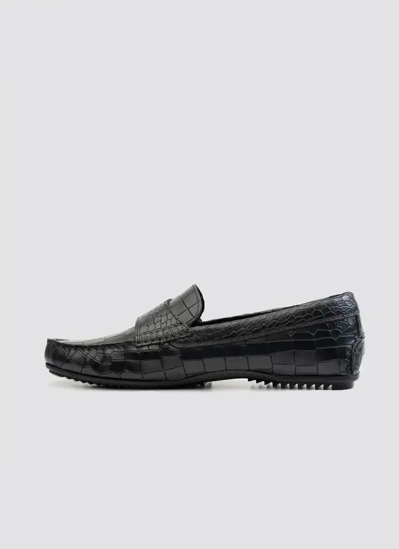 Black leather loafer with crocodile pattern texture, men's formal footwear, side view