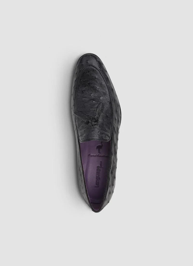 Black textured leather loafer for men with tassel detail, purple insole, top view