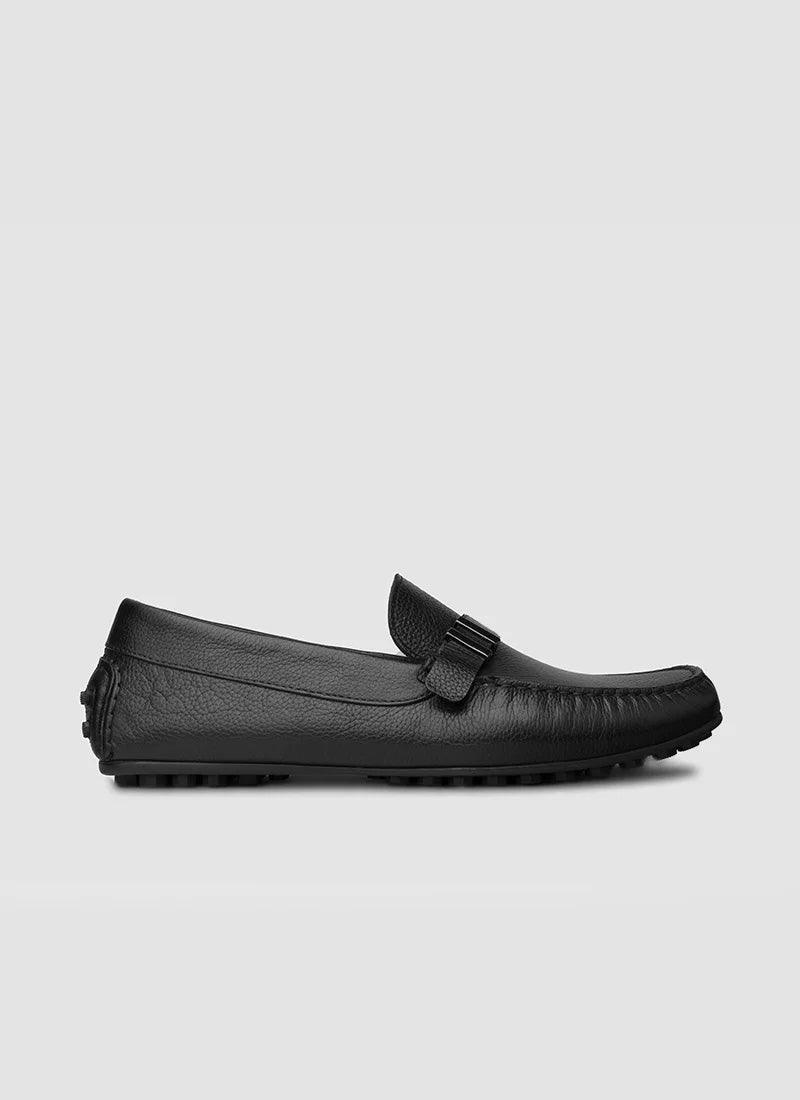 Men's black leather loafer with textured sole and penny strap, classic formal footwear