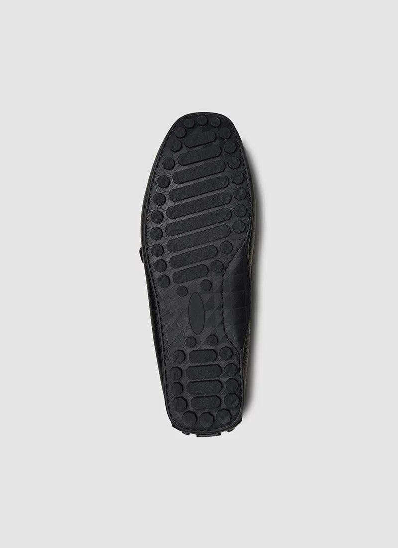 Black men's shoe sole with textured rubber grip, slip-resistant, on white background