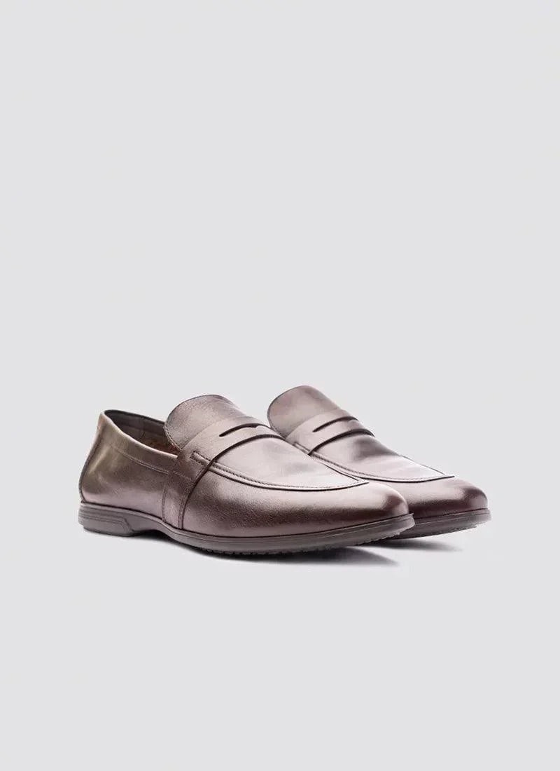 Men's brown leather loafers with penny strap detailing on a plain background