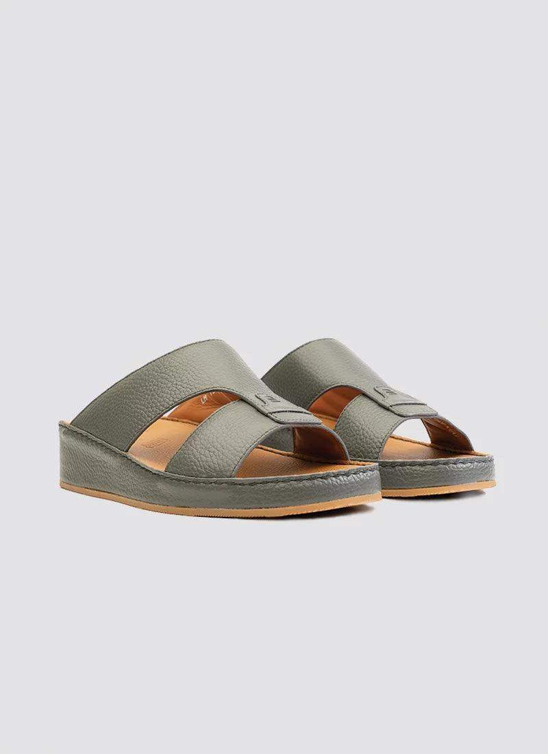 Grey leather men's open-toe sandals with wide straps and textured sole on a plain background