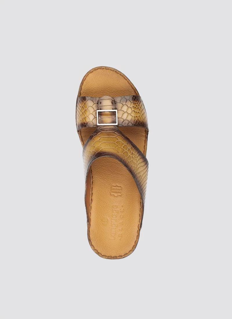 Tan leather men's slide sandal with snakeskin texture and buckle detail, top view