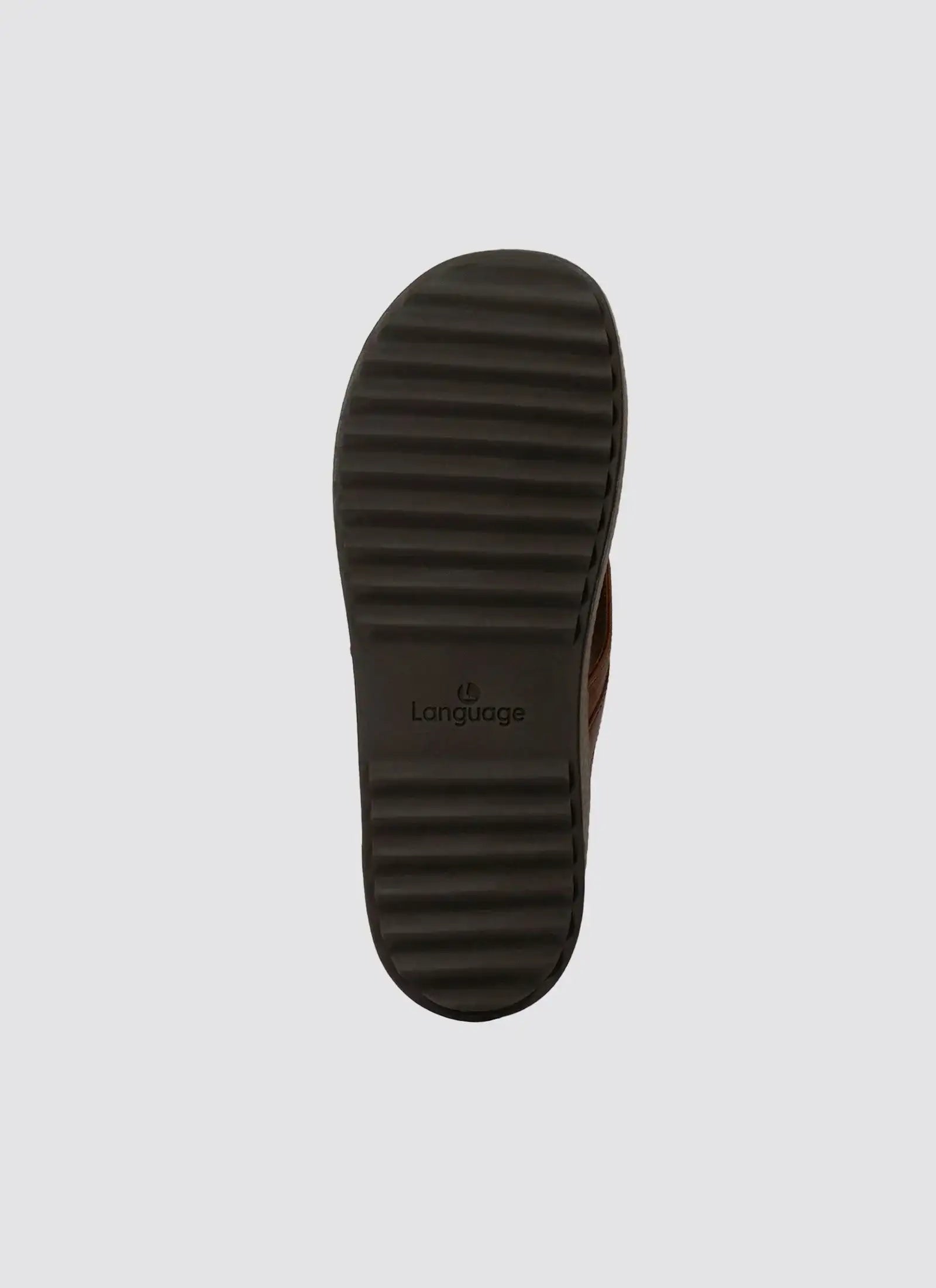 Tan shoe with ribbed black sole and logo, displayed on a plain background.