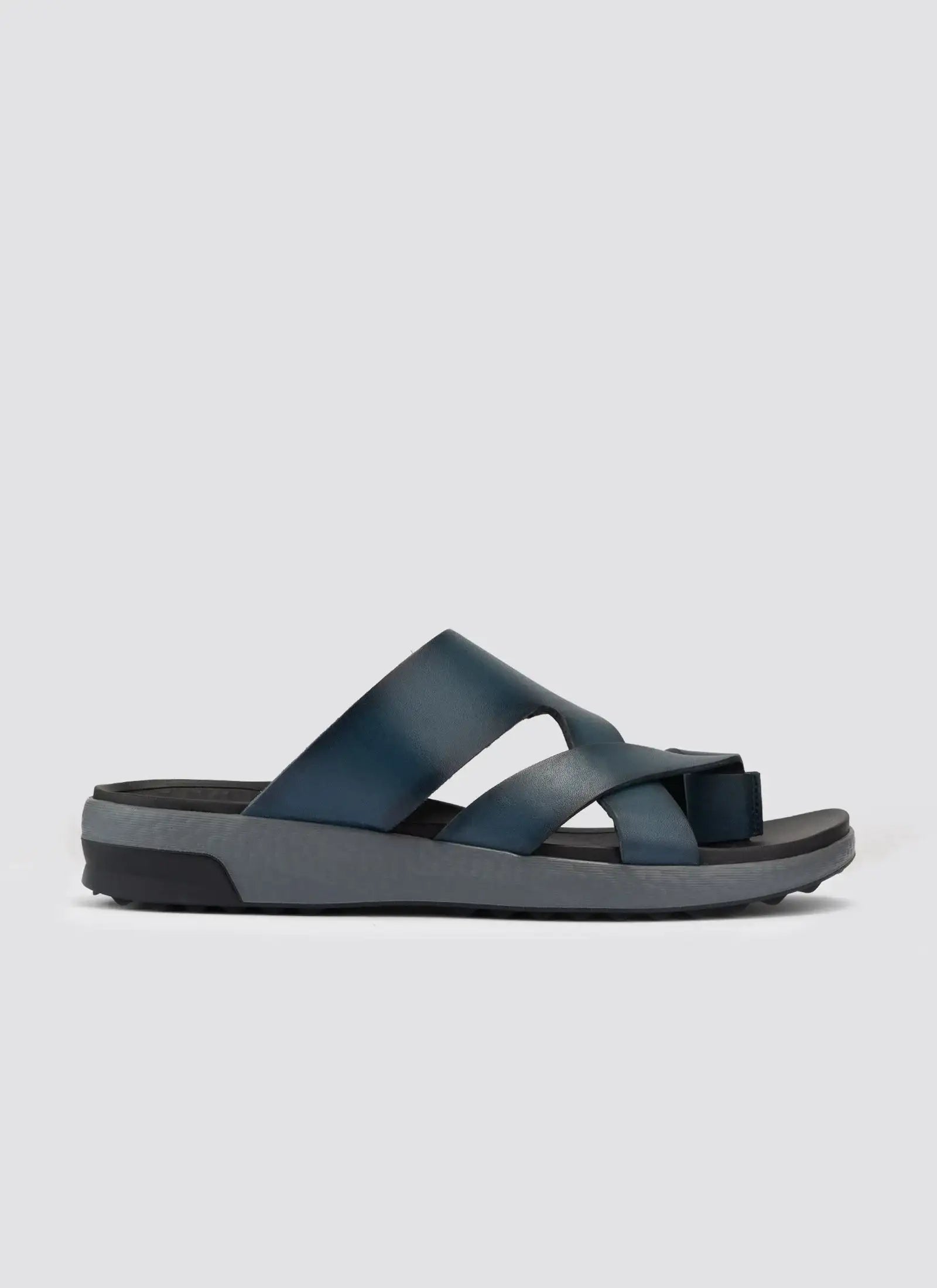 Men's navy blue leather sandals with criss-cross straps and textured sole on plain background #color_navy