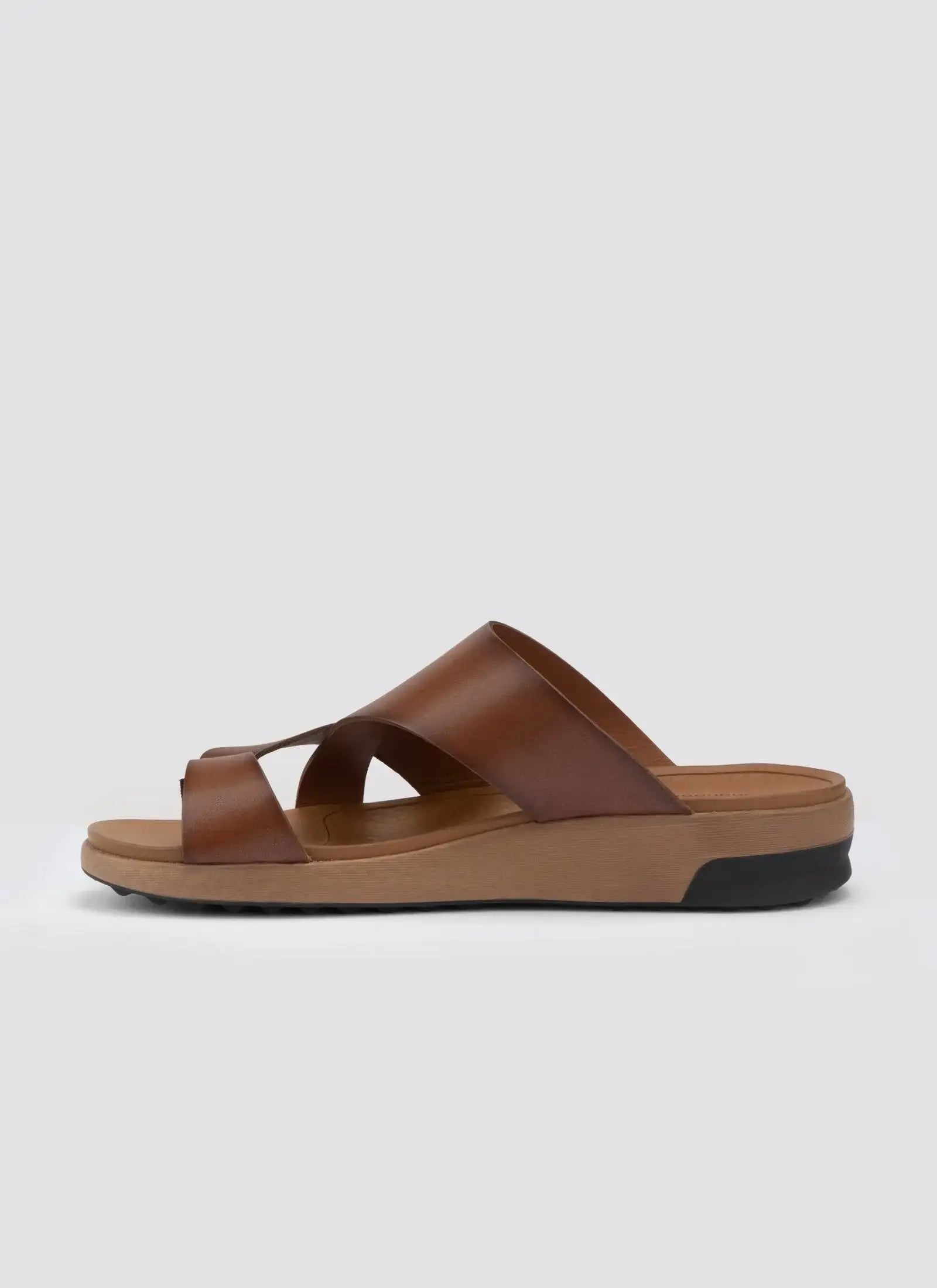 Tan brown leather slip-on sandal with criss-cross straps and cushioned sole for men
