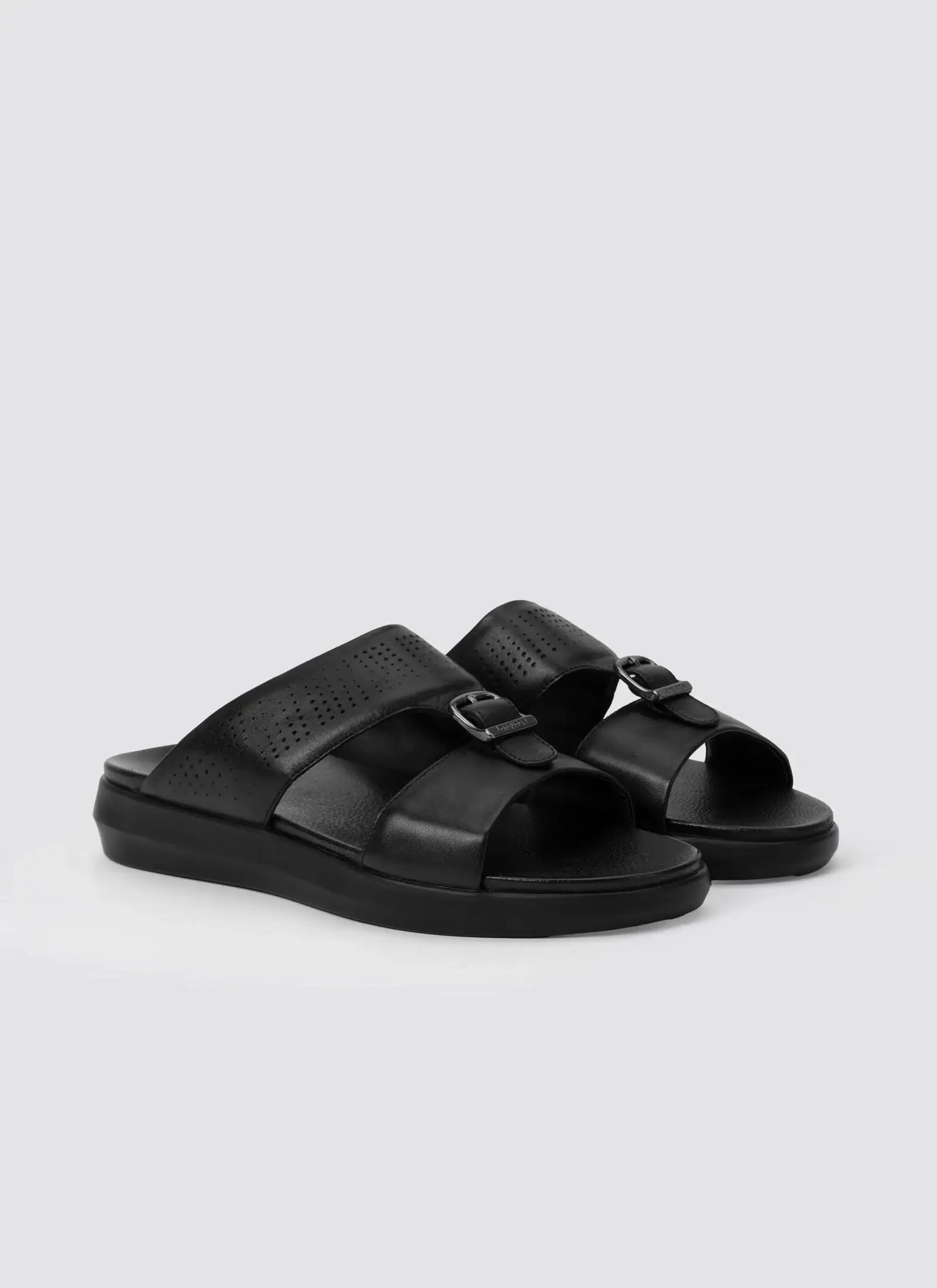 Black sandals on a light gray background