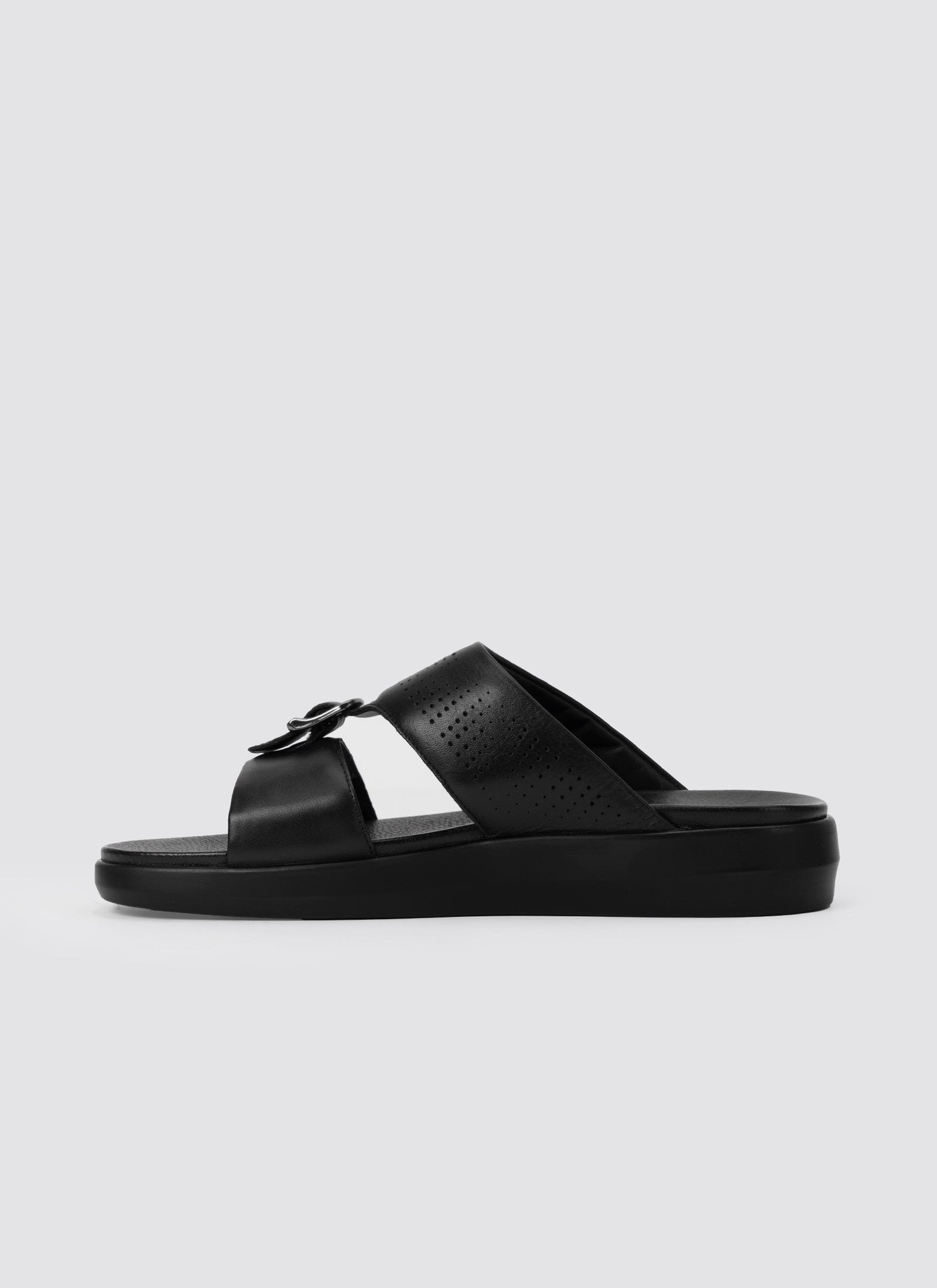 Black sandal on a light gray background