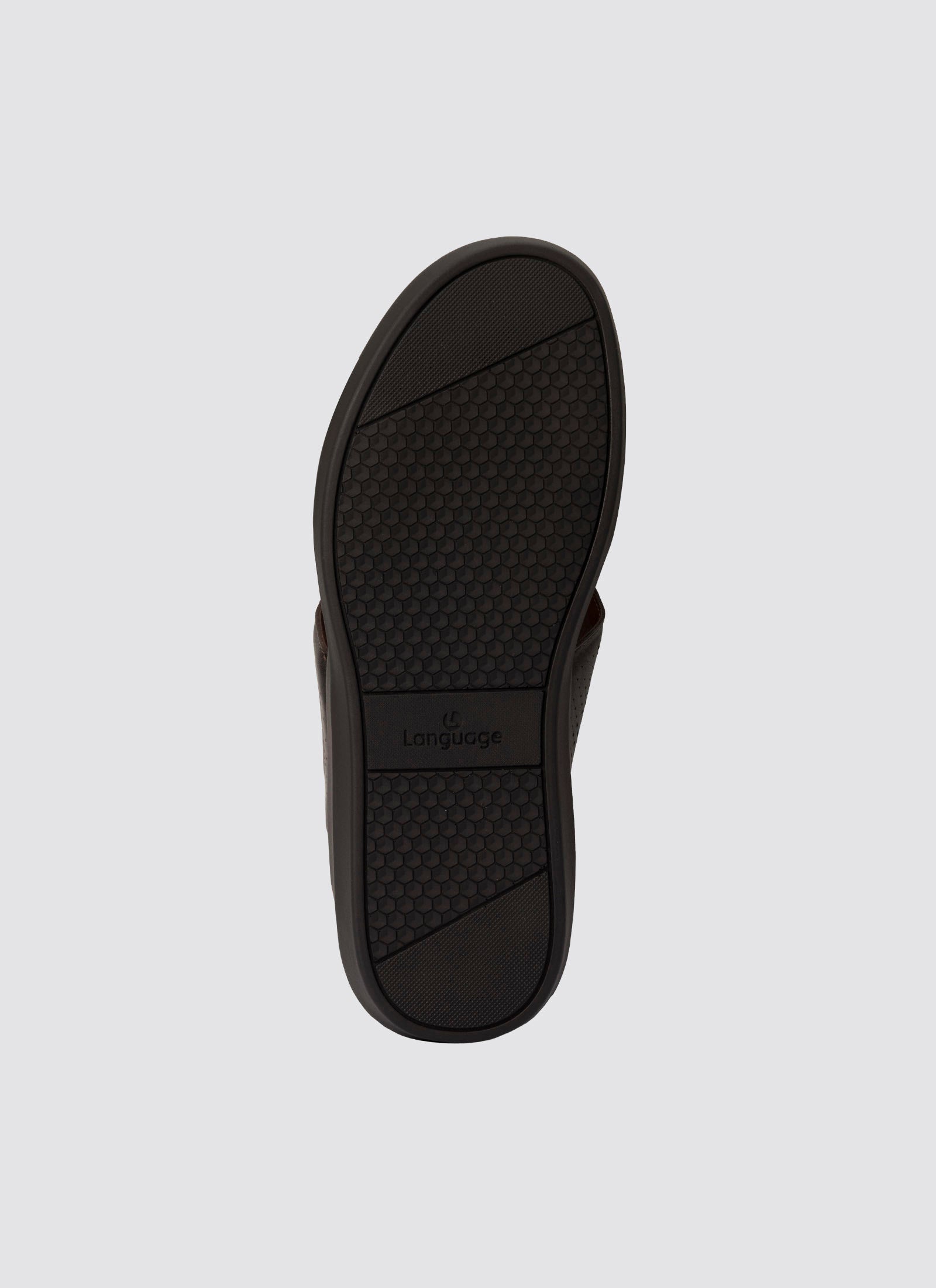 Black sandal sole with brand logo on a light gray background