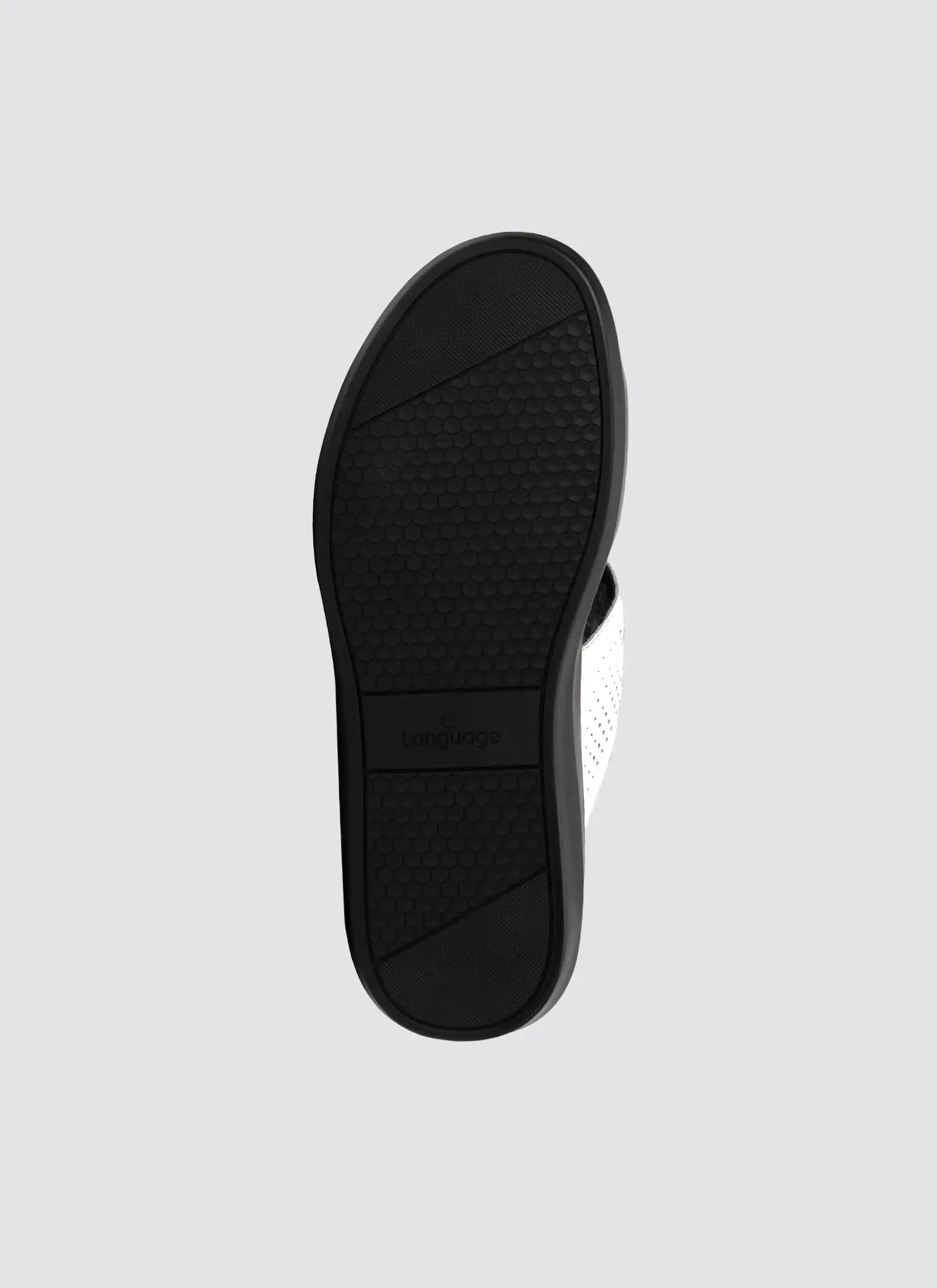 Black sandal sole on a light gray background