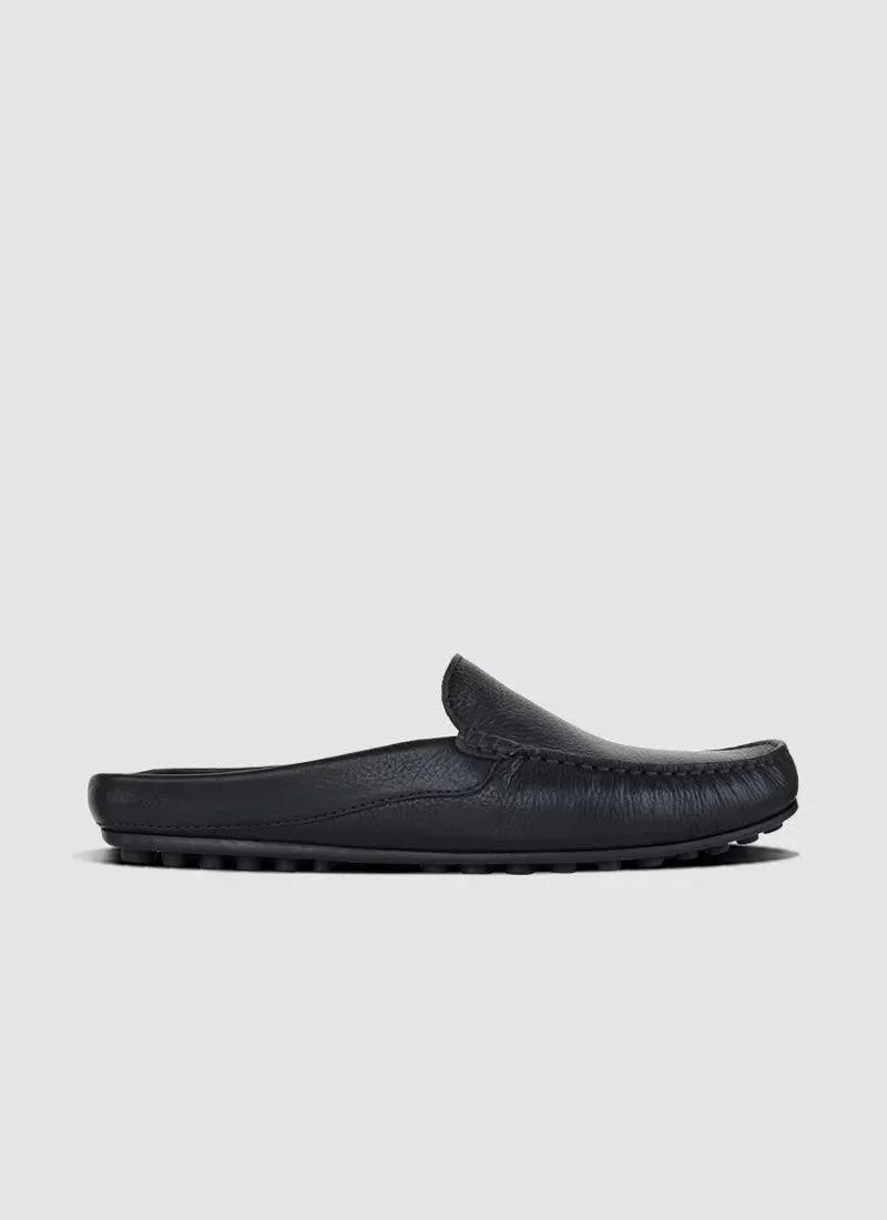 Black leather slip-on loafer for men with textured upper and rubber sole, side view