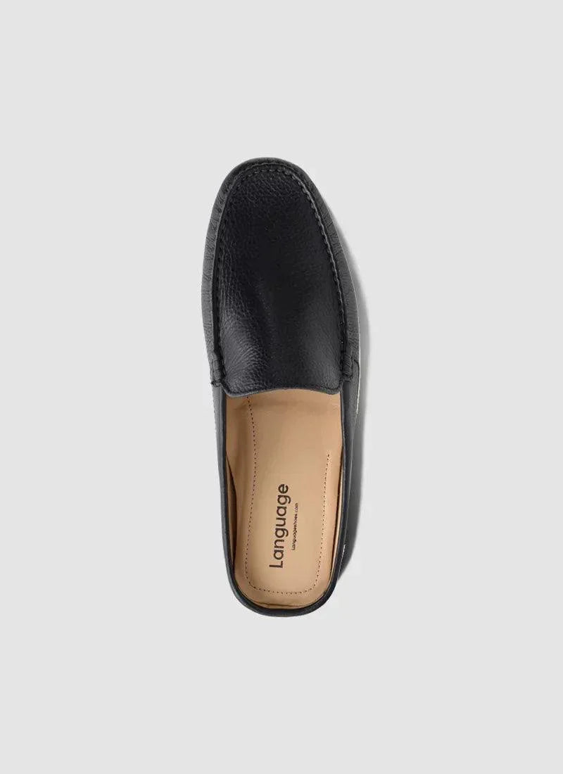 Black leather loafer shoe for men, top view, with tan insole on a plain background