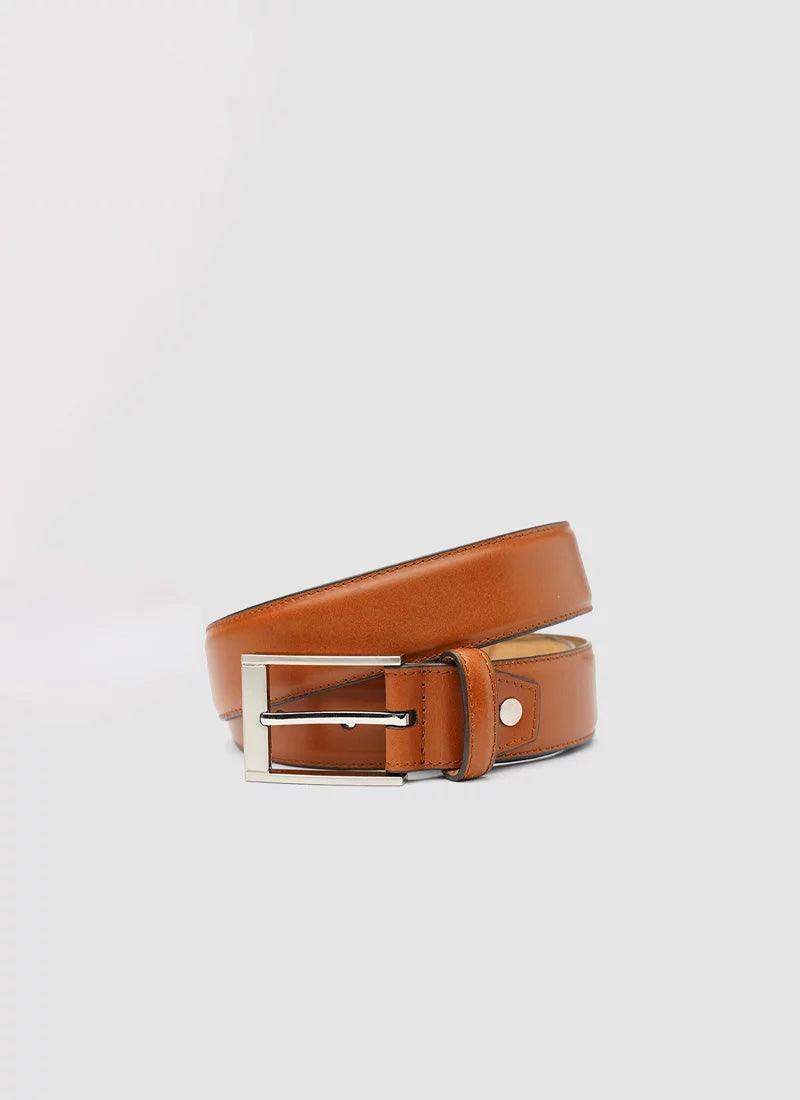 Tan leather men's belt with silver buckle on a plain background