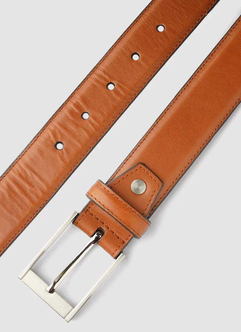 Tan leather belt with silver buckle for men on light background