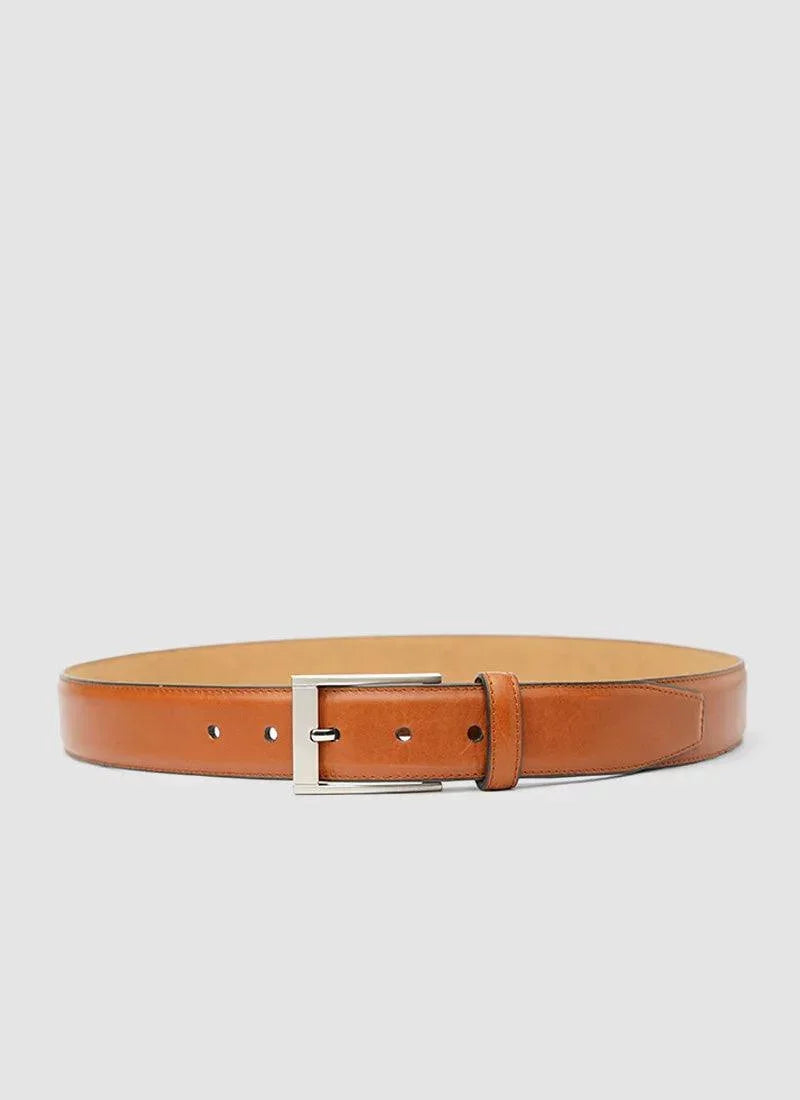 Tan leather belt with silver rectangular buckle on plain white background