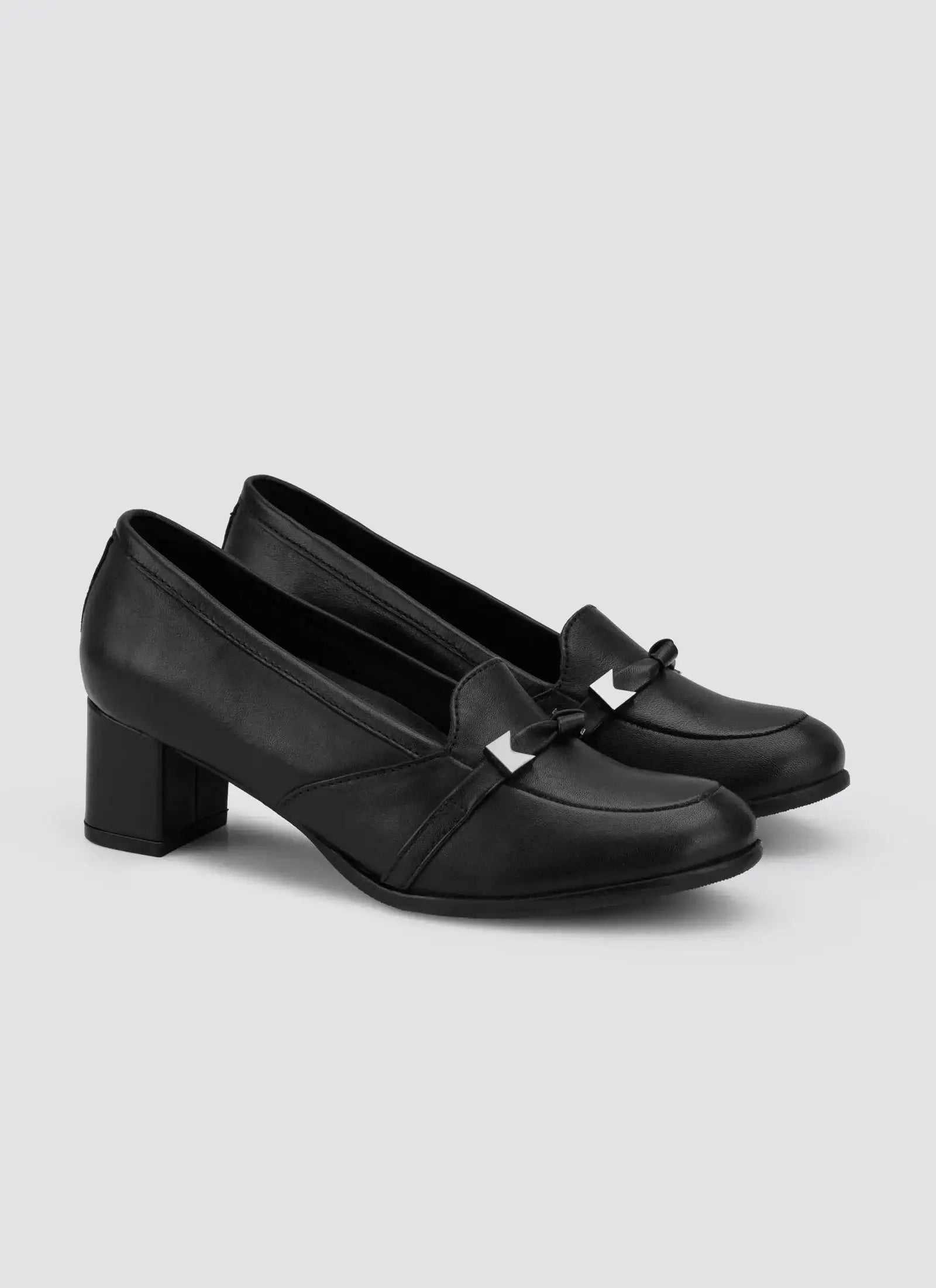 Black leather women's block heel loafers with decorative bow and silver accents