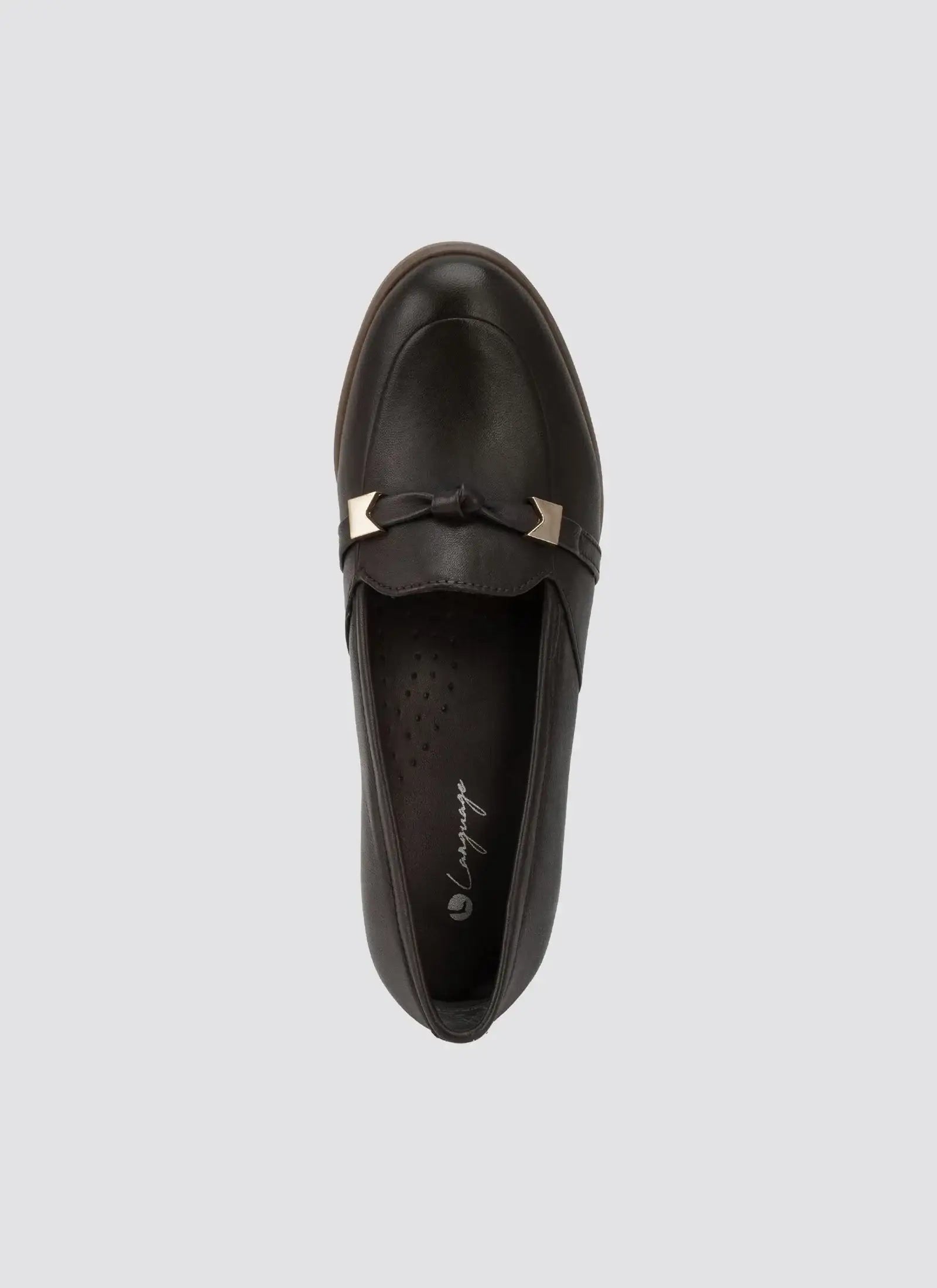 Brown leather loafer with gold hardware and bow detail, top view on light background
