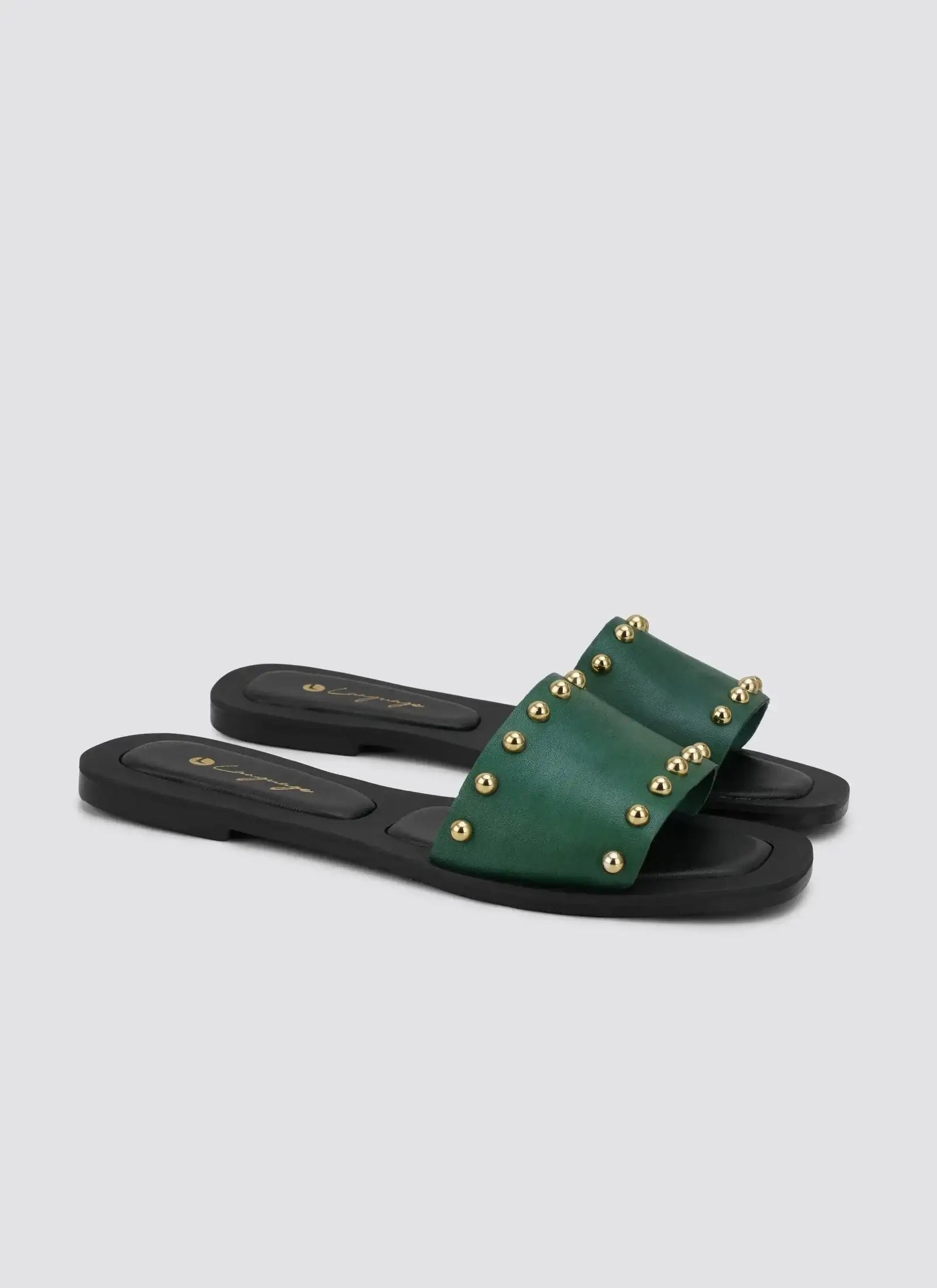 Green studded women’s slide sandals with black sole, displayed on a light background #color_sage
