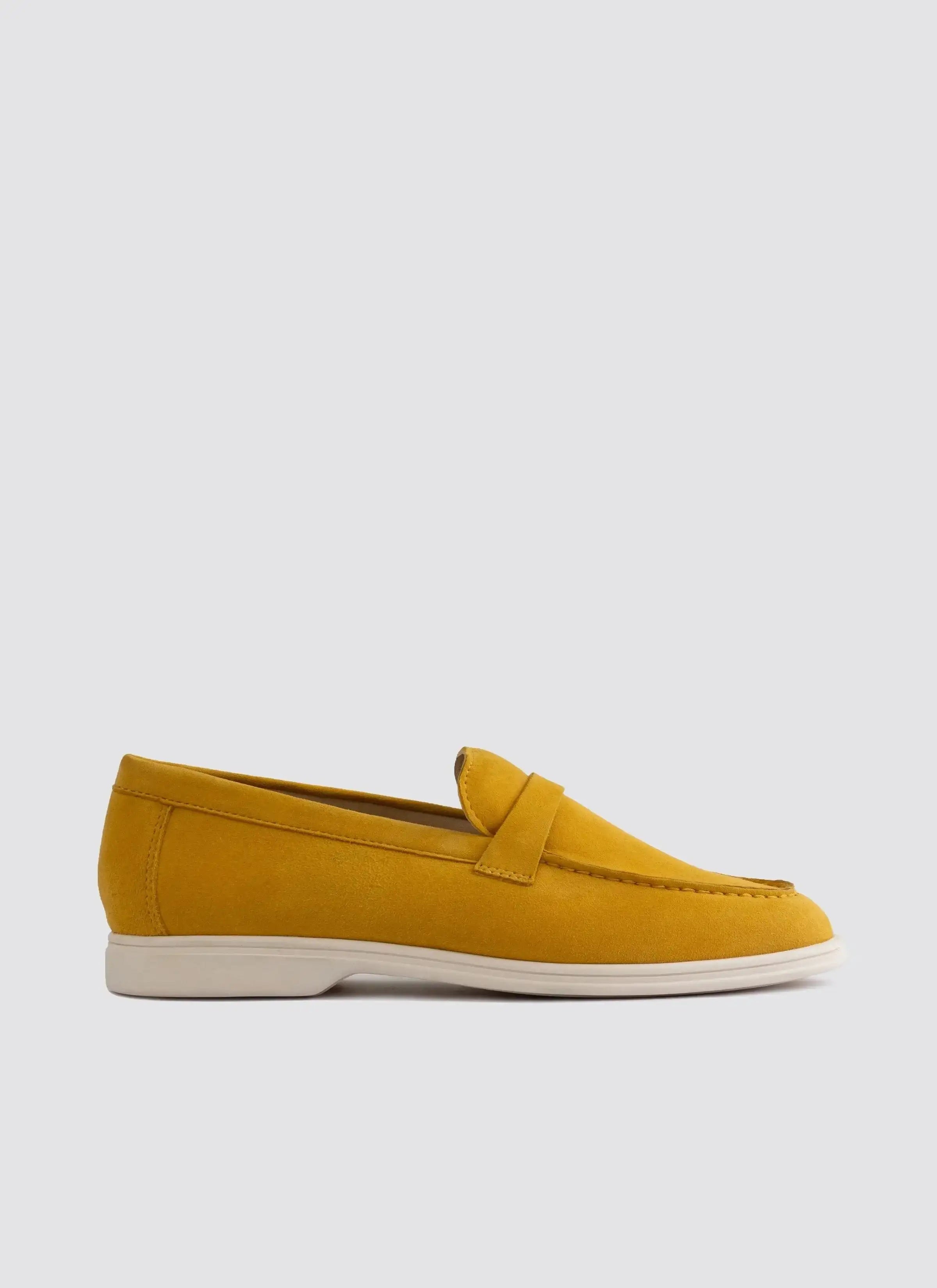Mustard yellow suede loafer with white sole for men, side view on white background