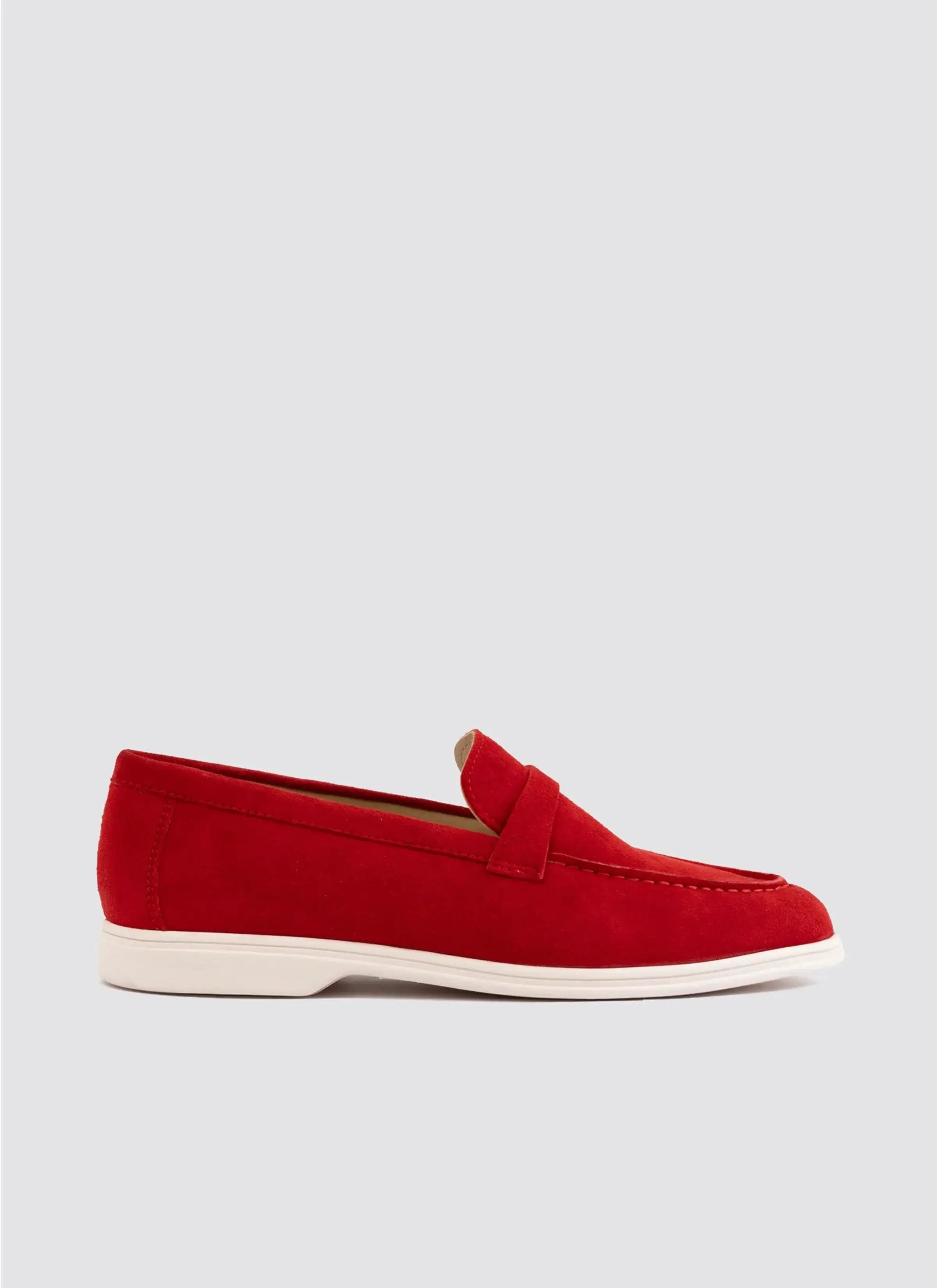Red suede loafer with white sole, classic slip-on footwear for men on a plain background