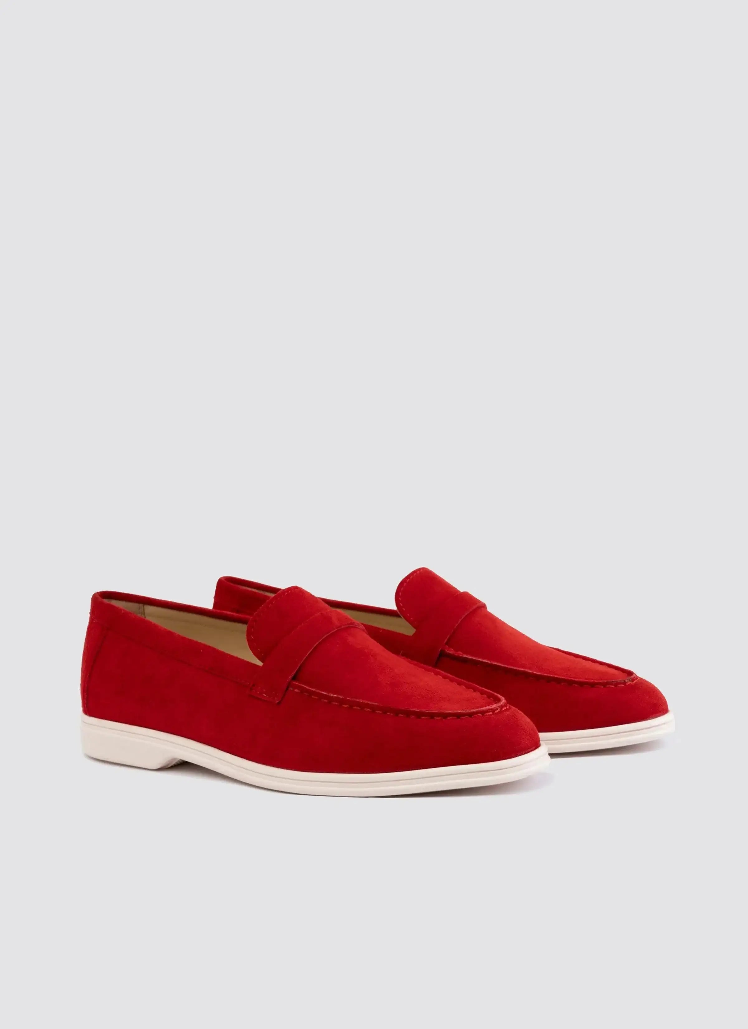 Red suede loafers with white soles for men, premium casual footwear on white background