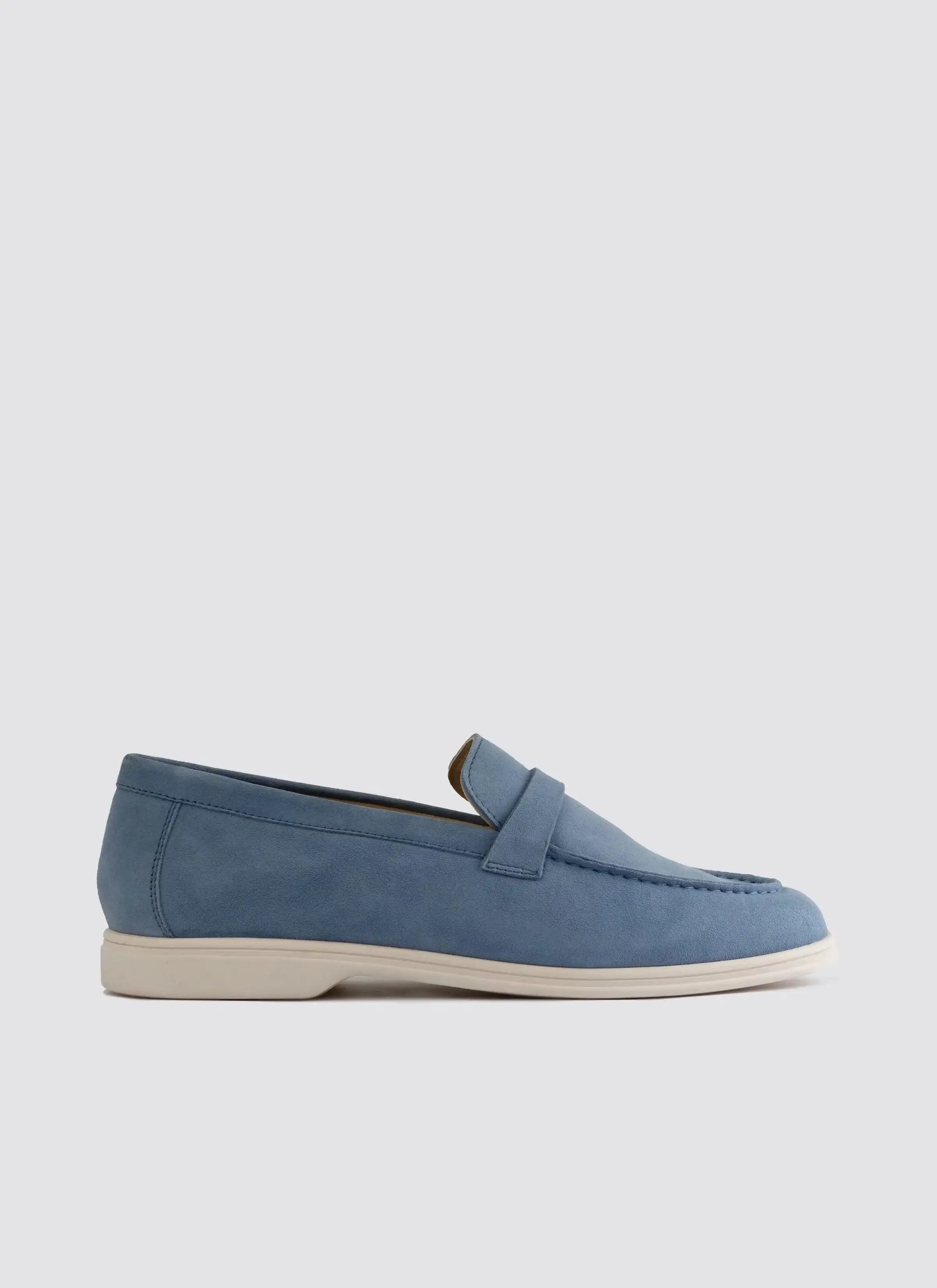 Light blue suede loafer with white sole, casual men's footwear on plain background