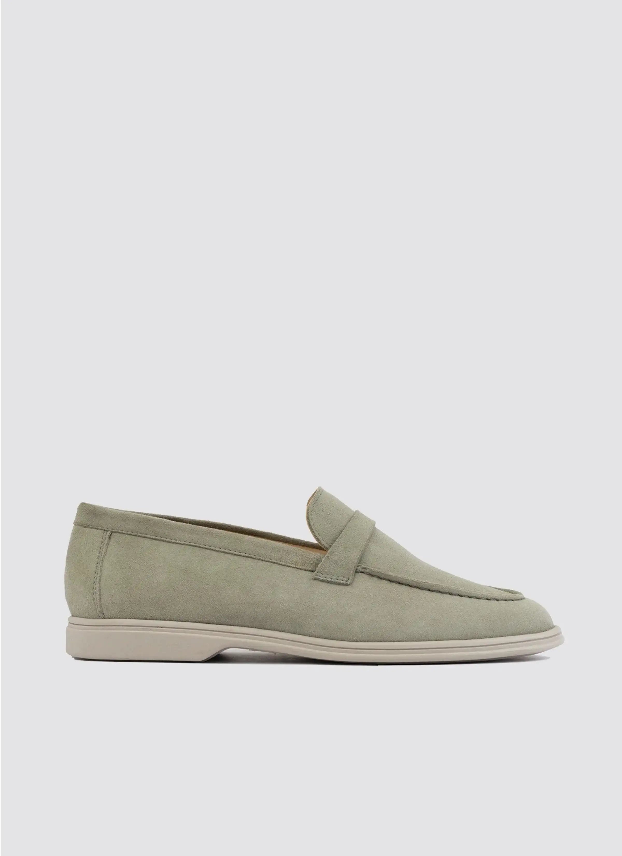 Men's light olive suede loafer with penny strap and rubber sole, side view