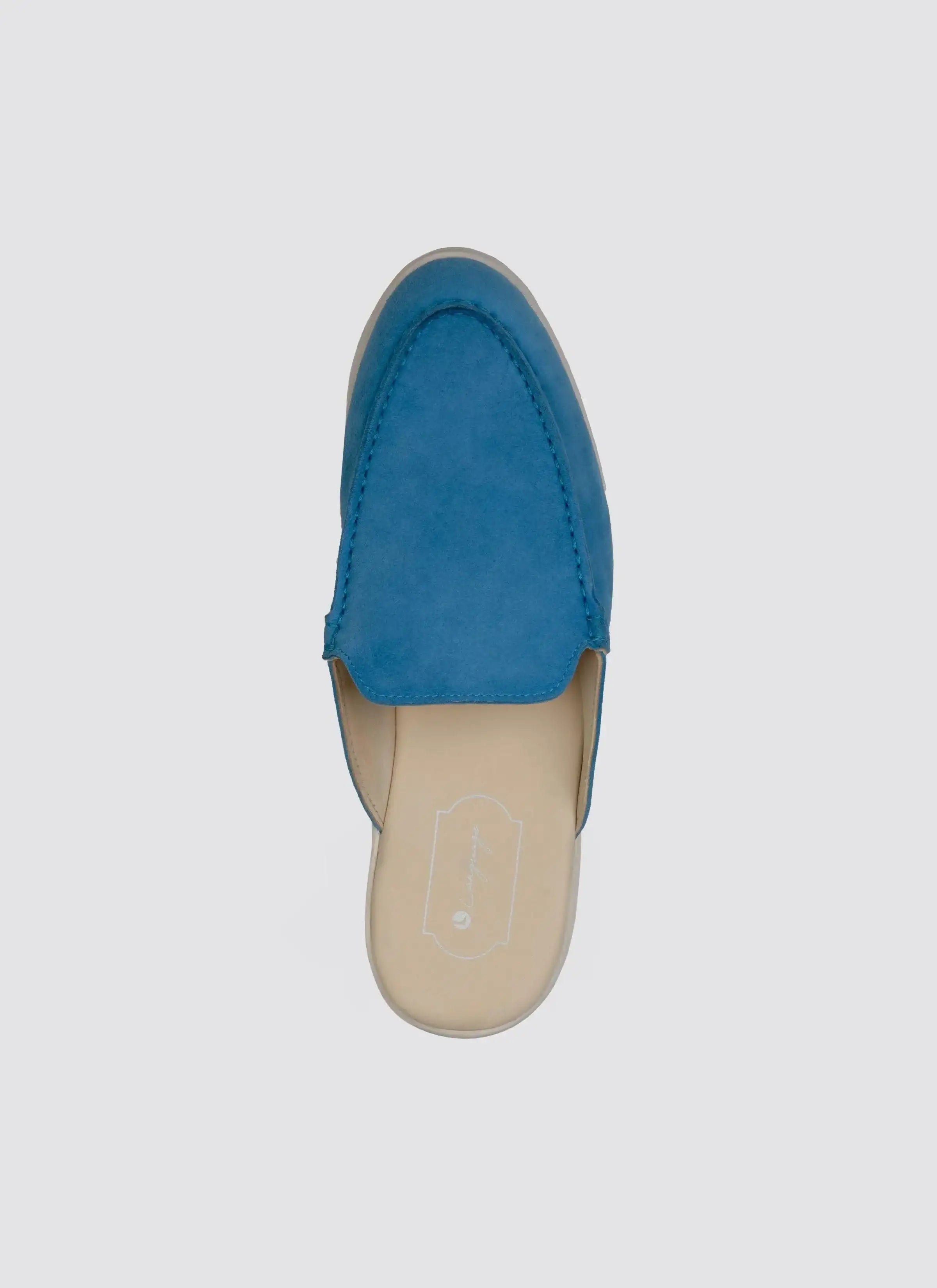 Top view of a blue suede slip-on loafer for men against a white background