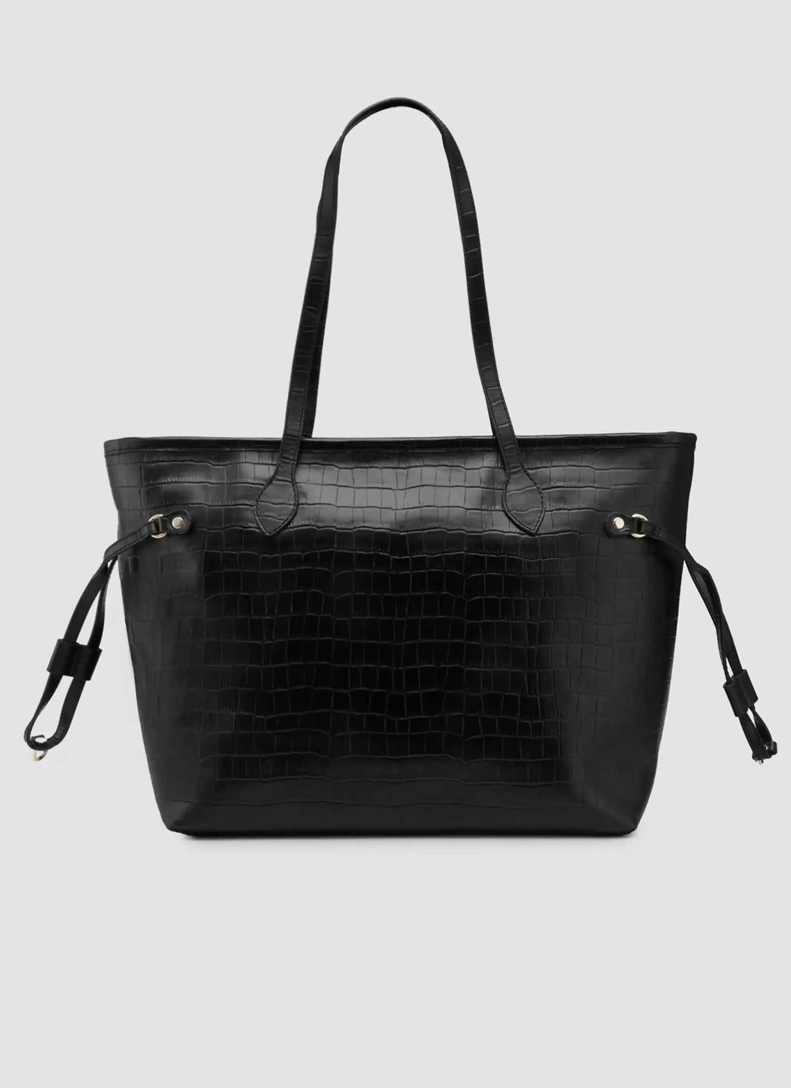Black handbag with crocodile texture on a light gray background