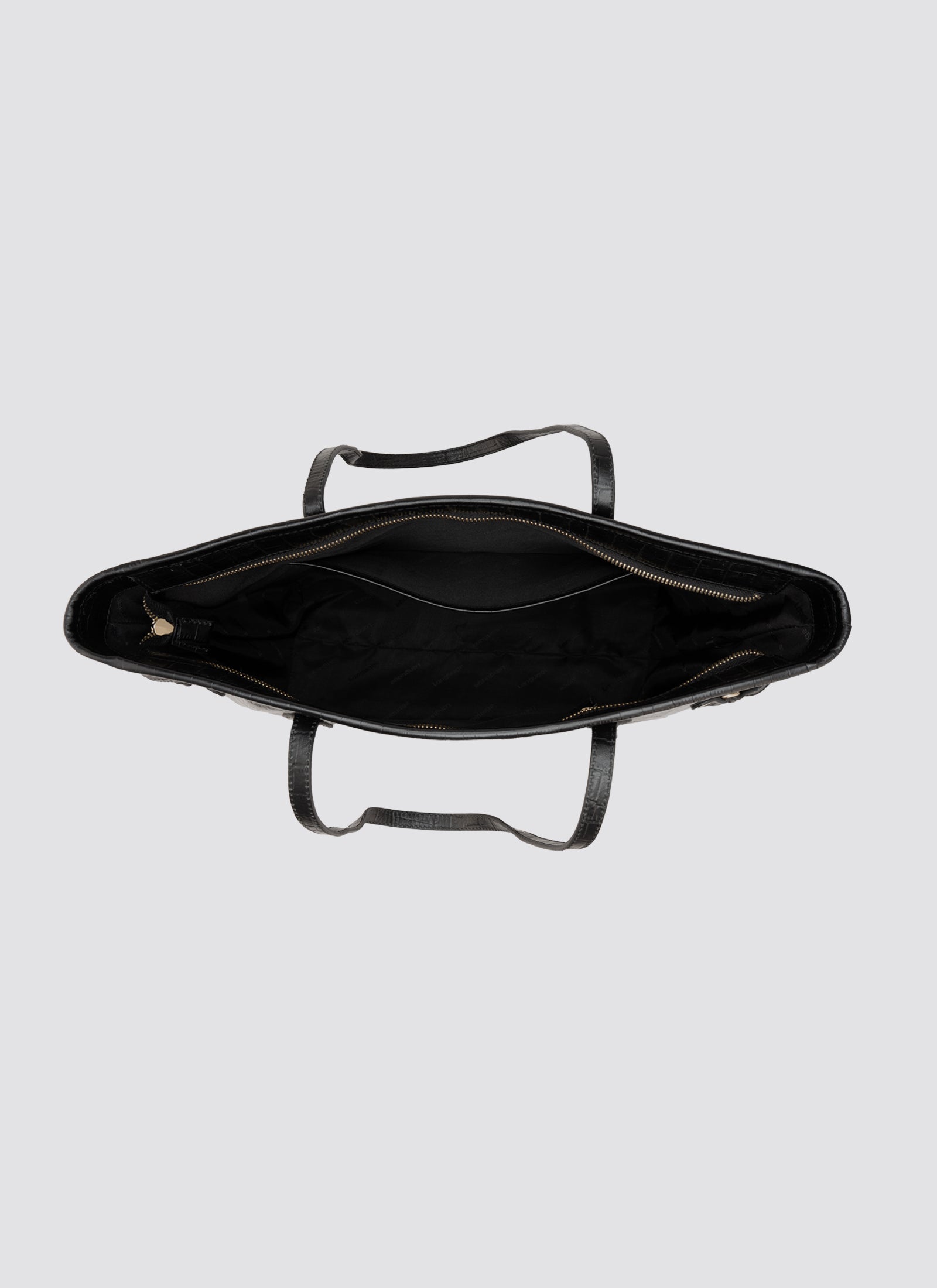 Black metal tray with handles on a light gray background