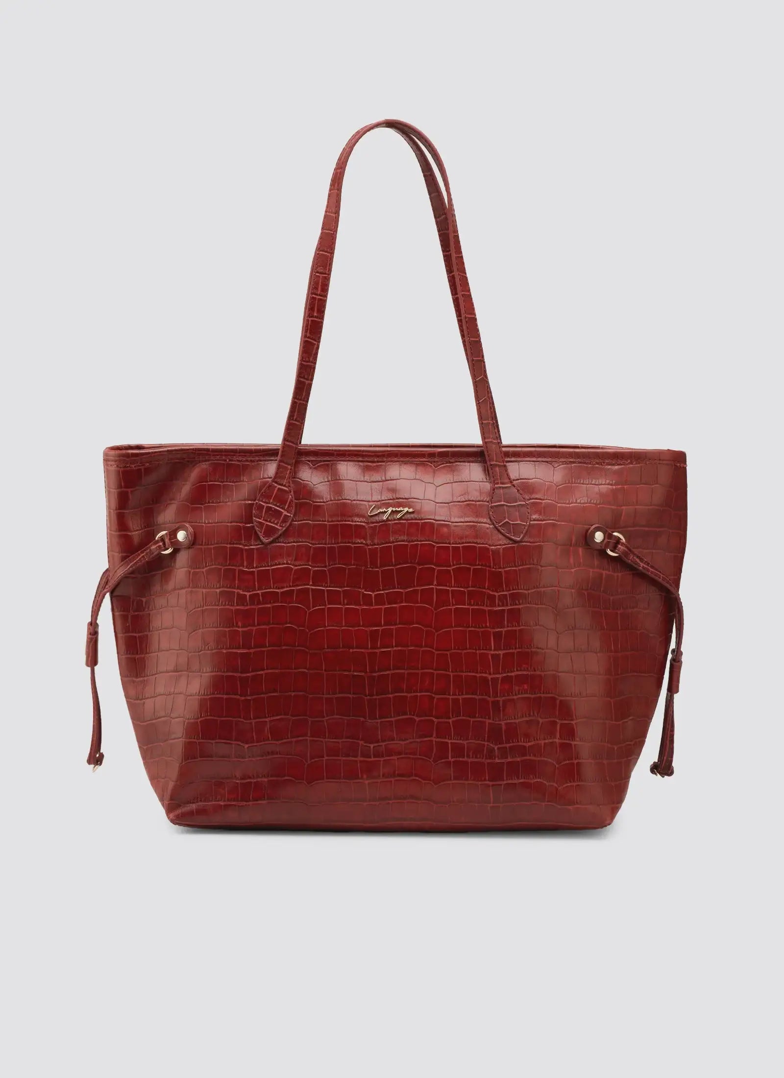 Red leather handbag with a textured pattern on a light gray background #color_red