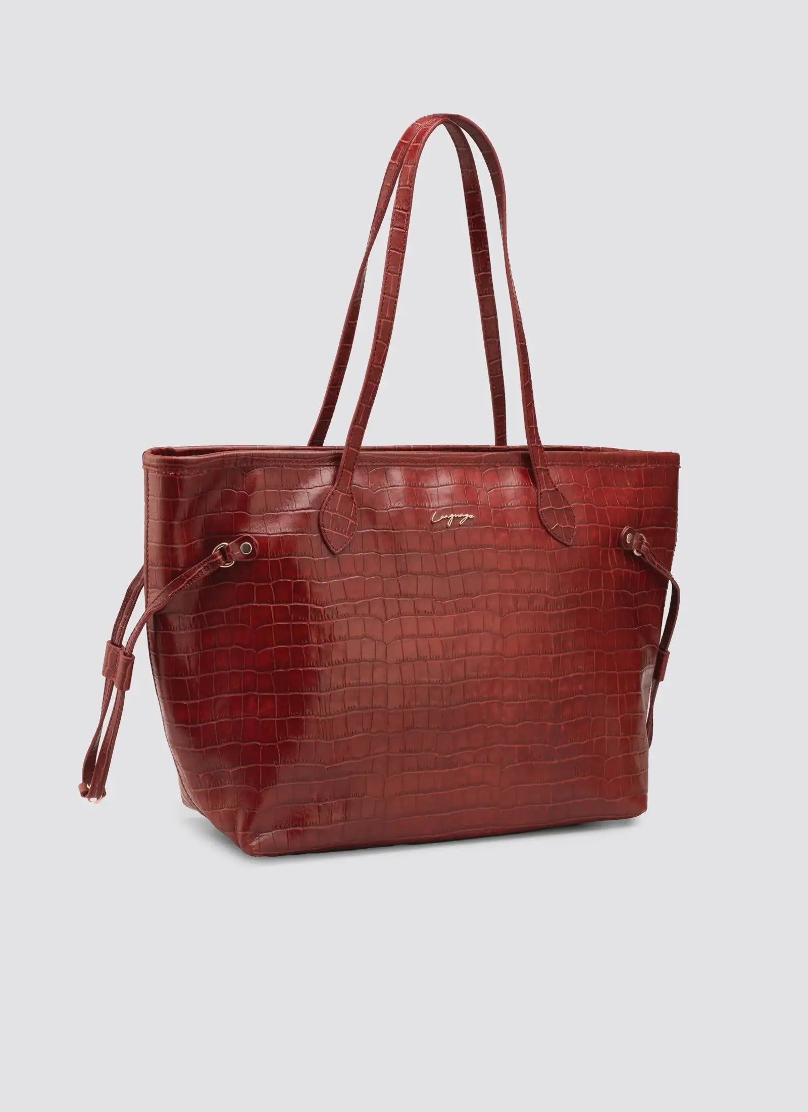 Red leather tote bag on a light gray background #color_red