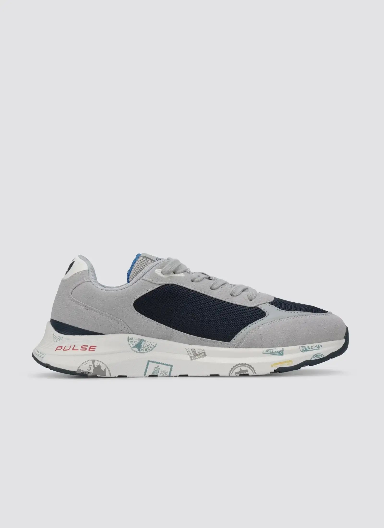 Grey and navy blue men's sneaker with travel stamp print sole, side view on white background