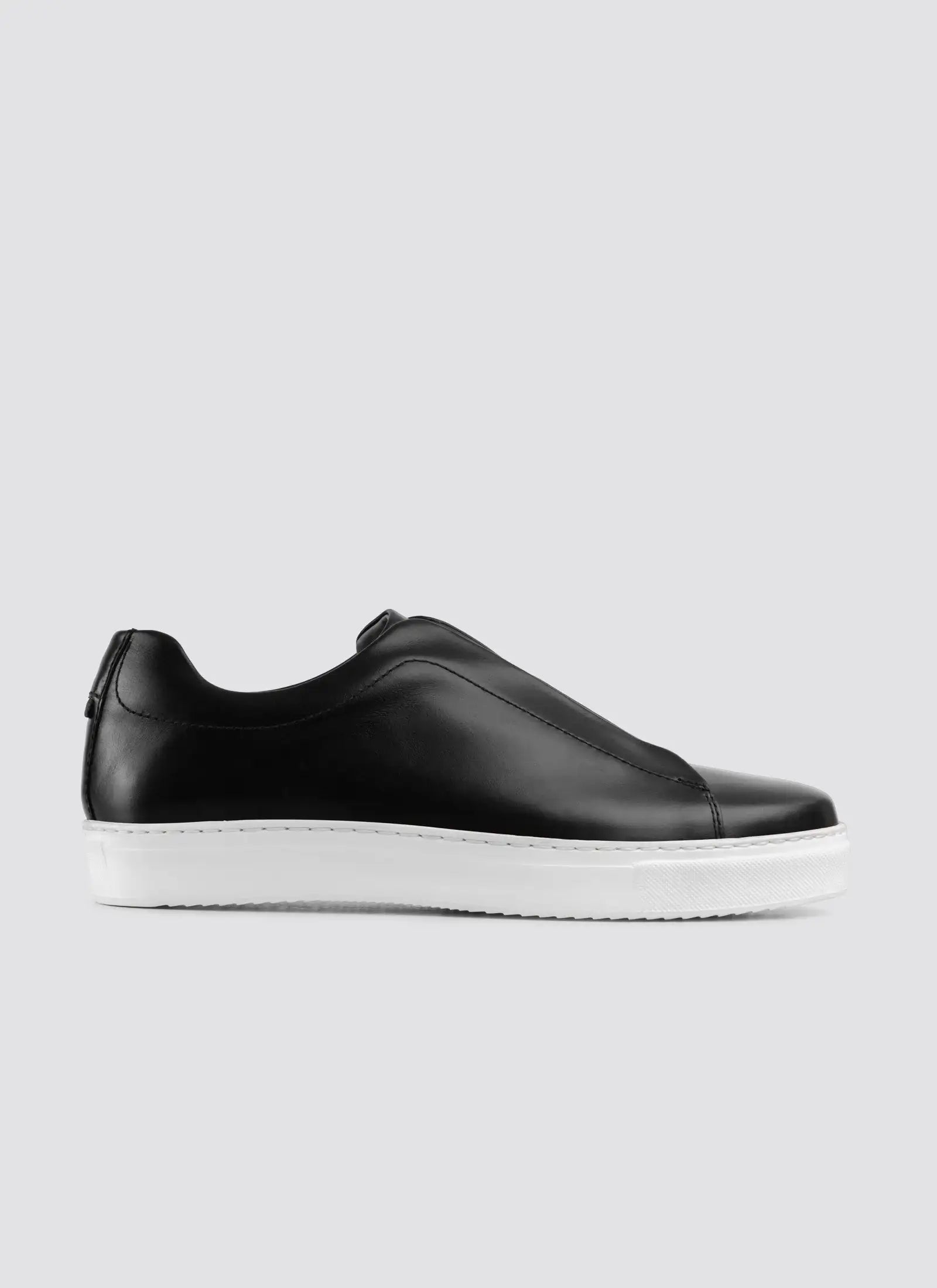 Brown suede boat shoe on a white background