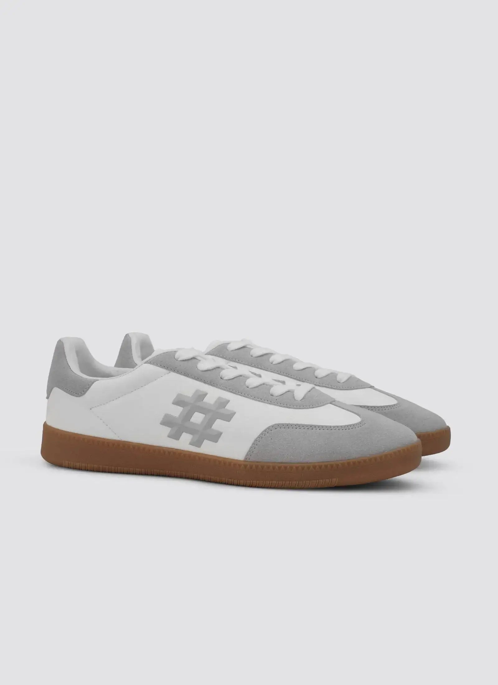Men’s white and grey sneakers with suede accents and gum sole, casual footwear