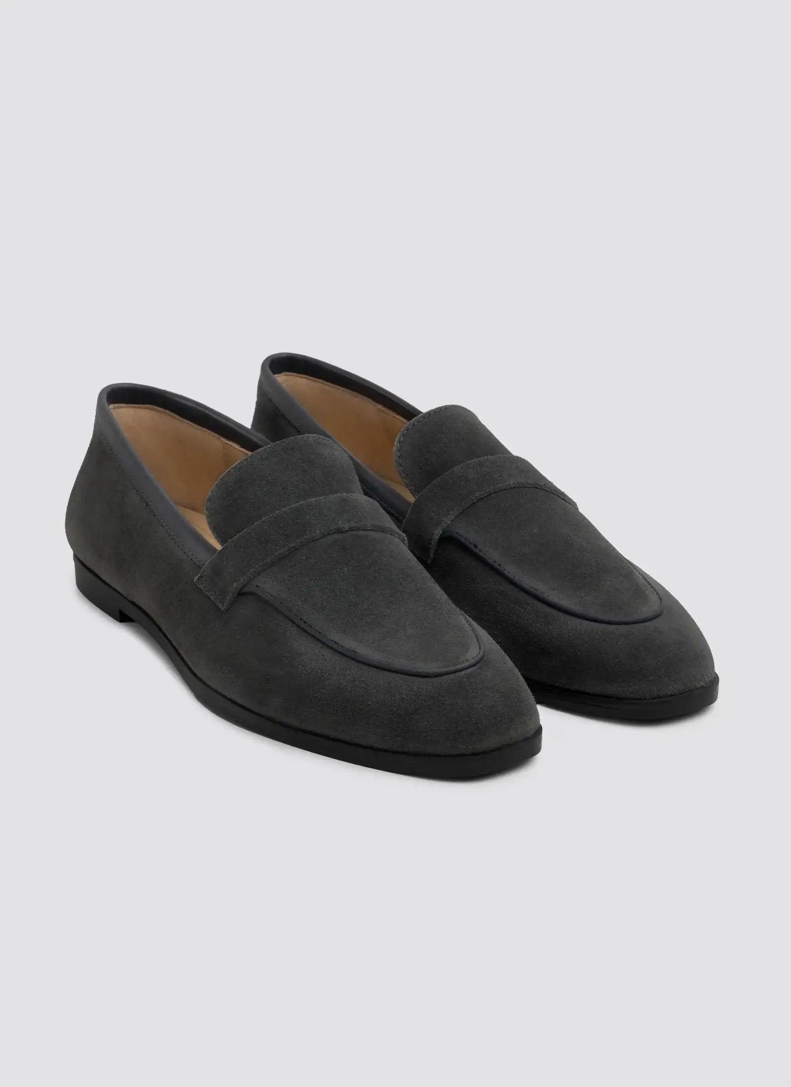 Black patent leather shoes on a white background #color_dark-grey