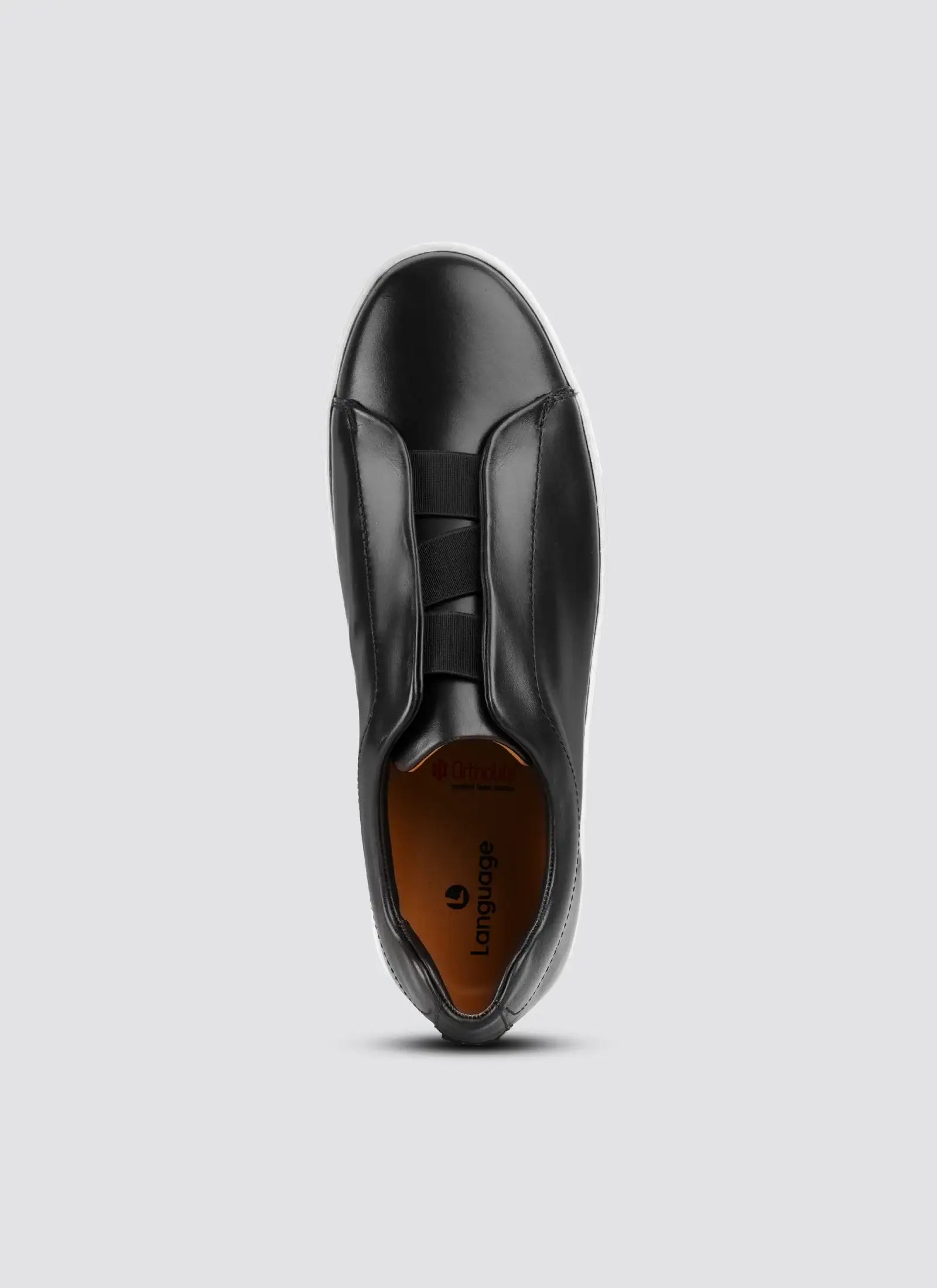 Black leather shoe on a light gray background