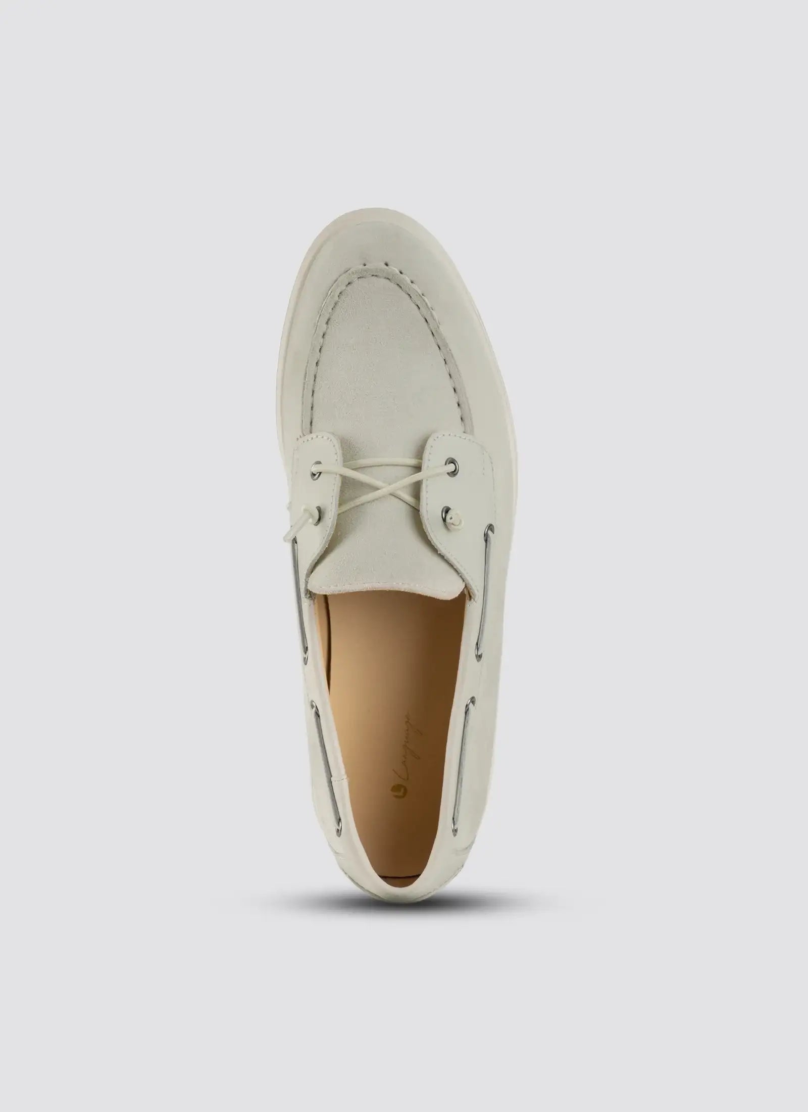 White loafer shoe on a light gray background